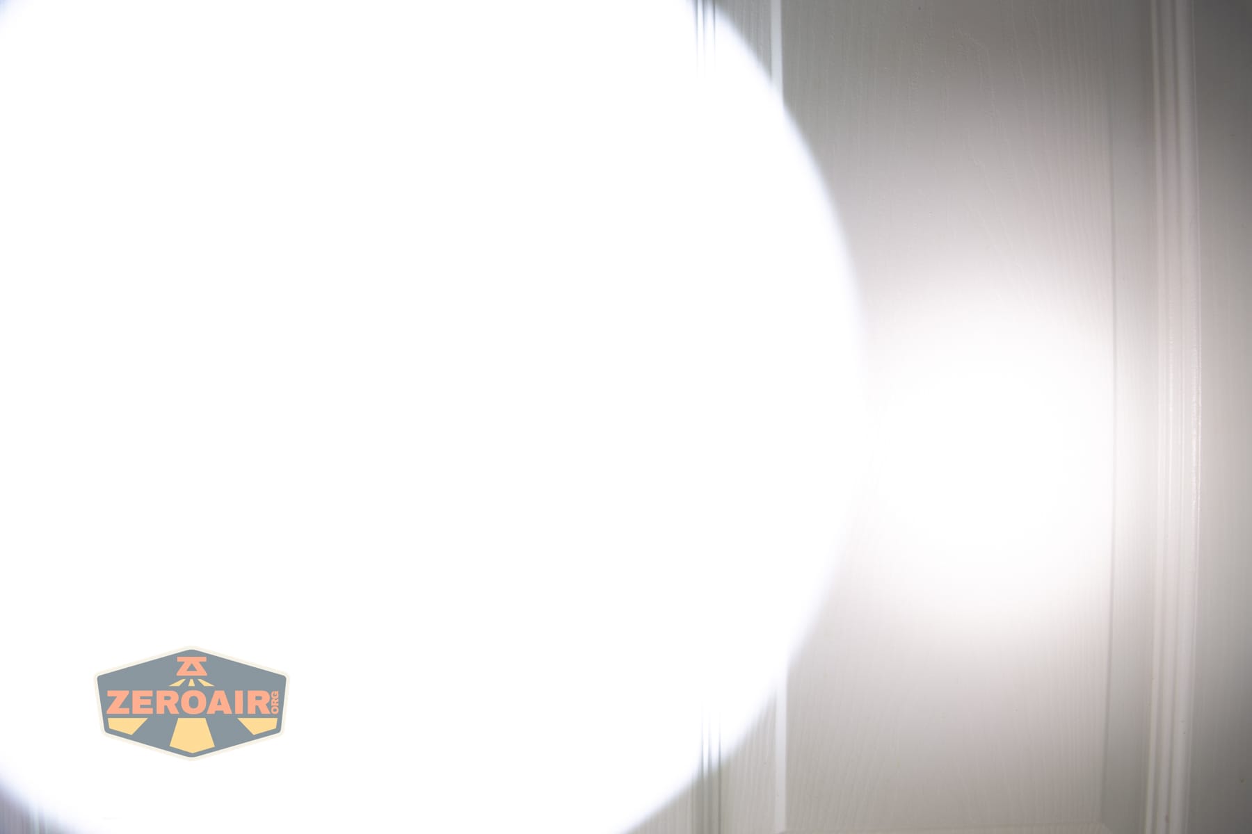 Armytek Predator Pro Max 2026 beamshots on door (at 1') compared to nichia 219b 4500K