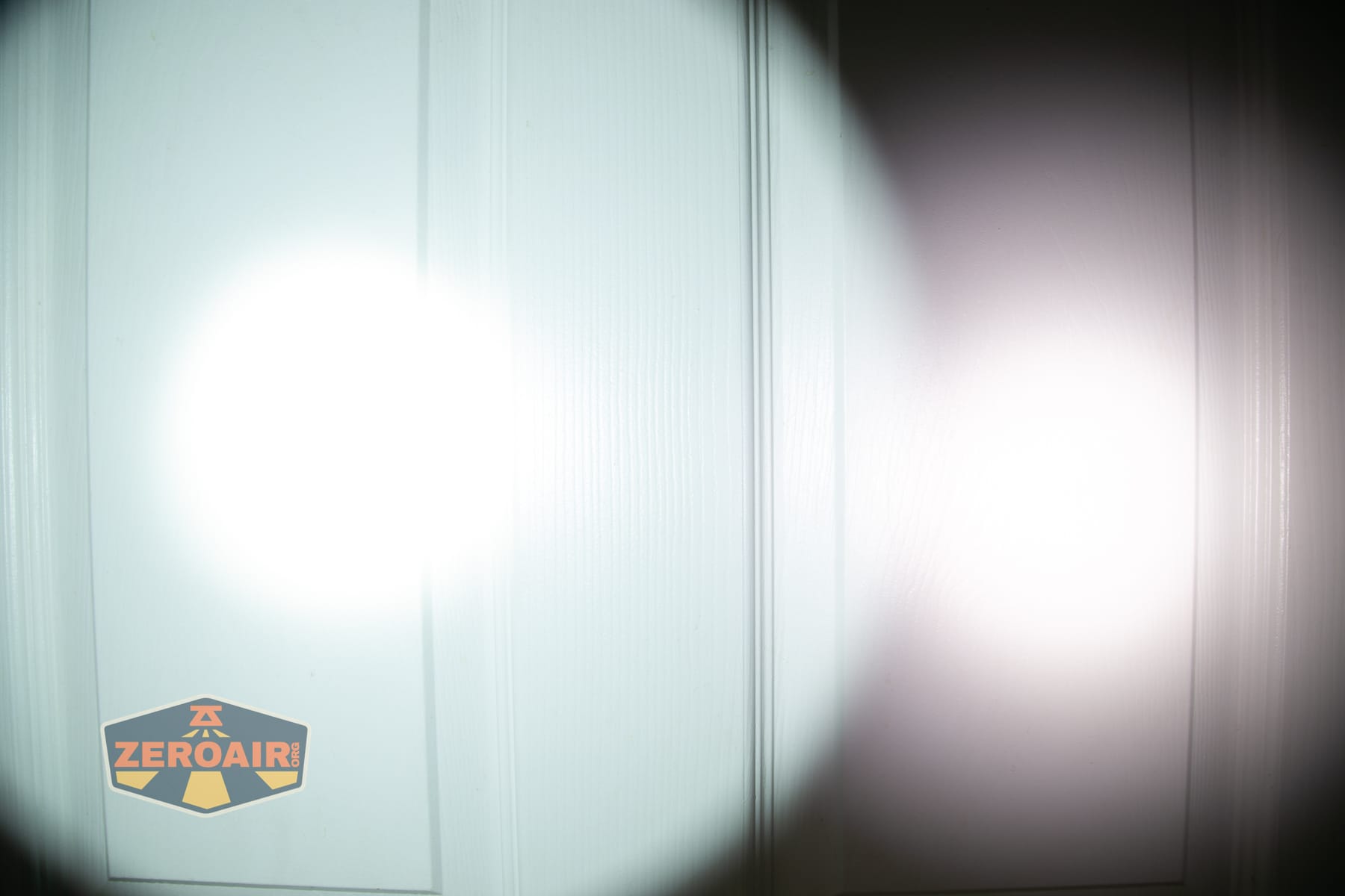 Armytek Predator Pro Max 2026 beamshots on door (at 1') compared to nichia 219b 4500K