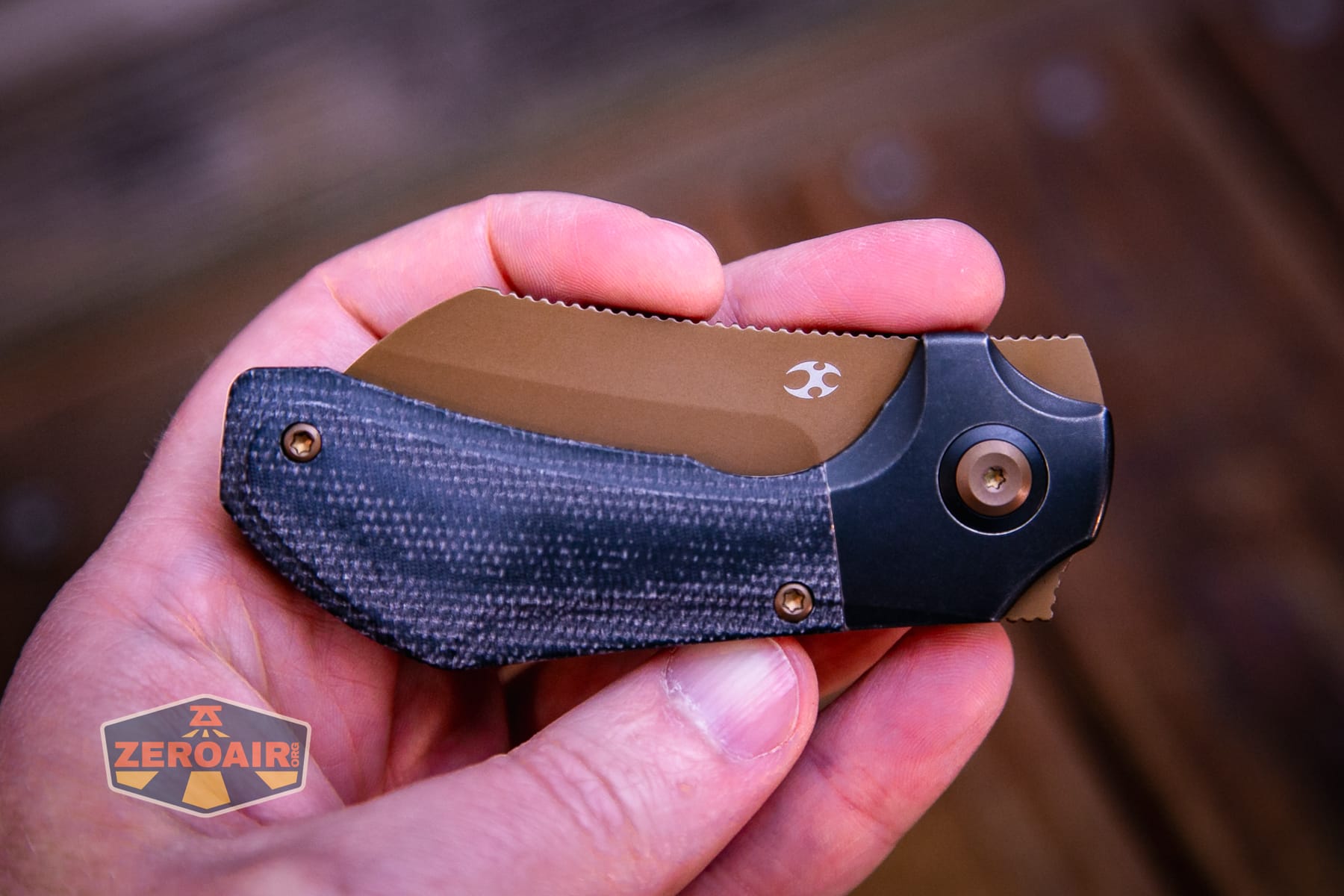 Kansept Pluto S90V knife in hand