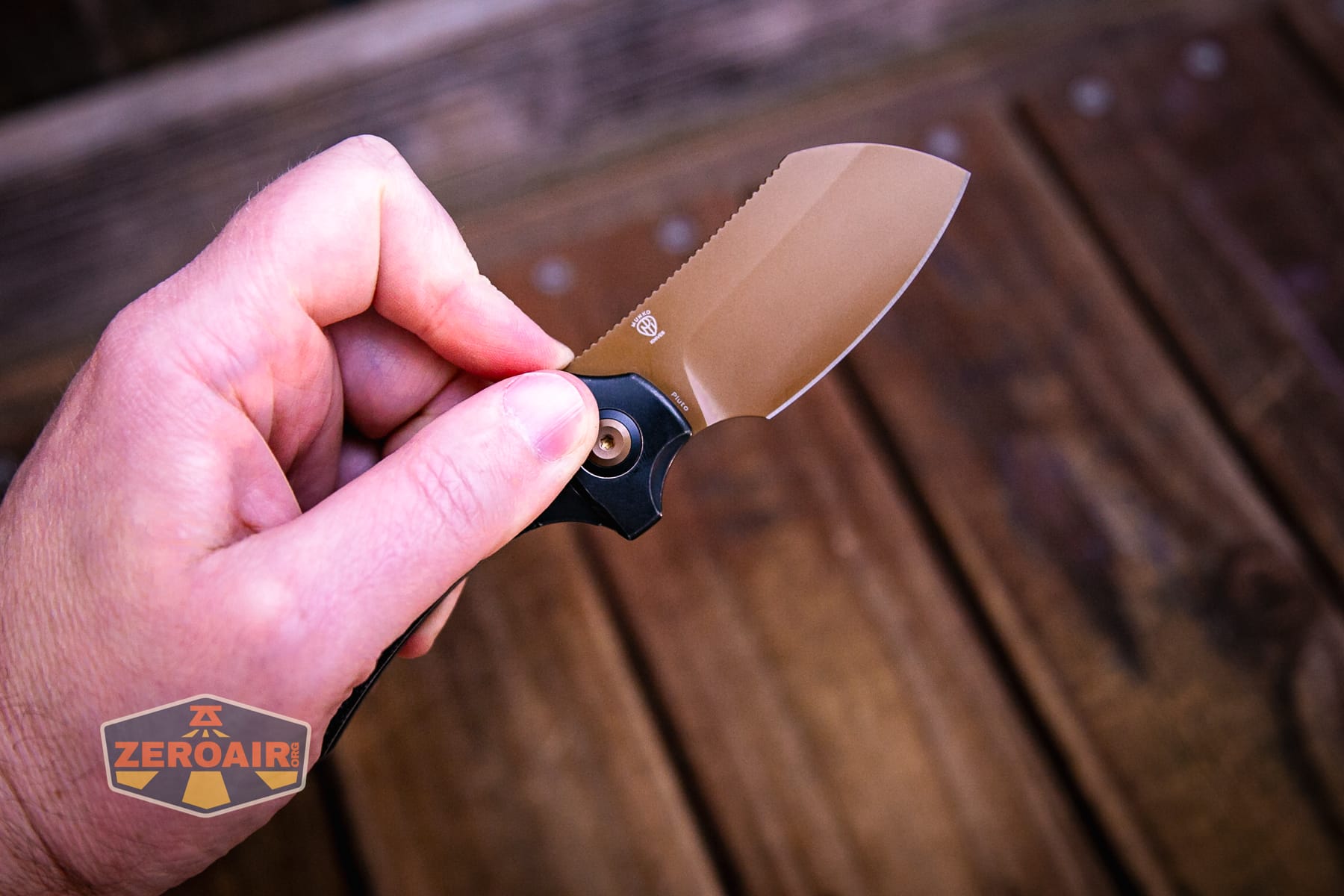 Kansept Pluto S90V knife open in hand