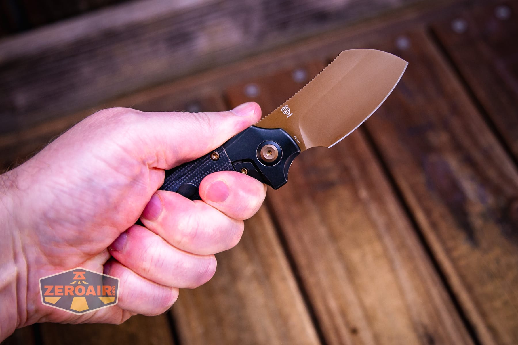 Kansept Pluto S90V knife open in hand