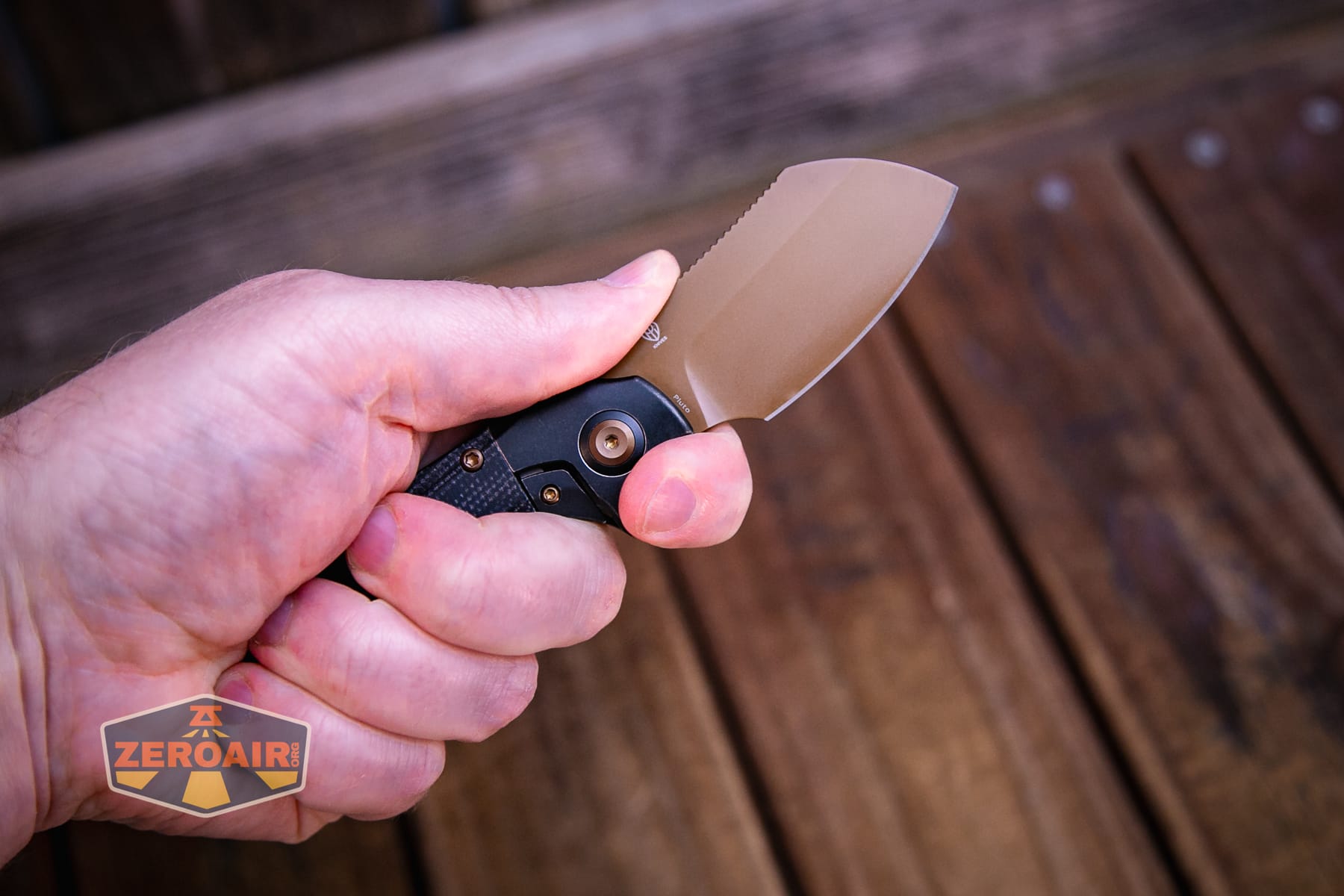 Kansept Pluto S90V knife open in hand