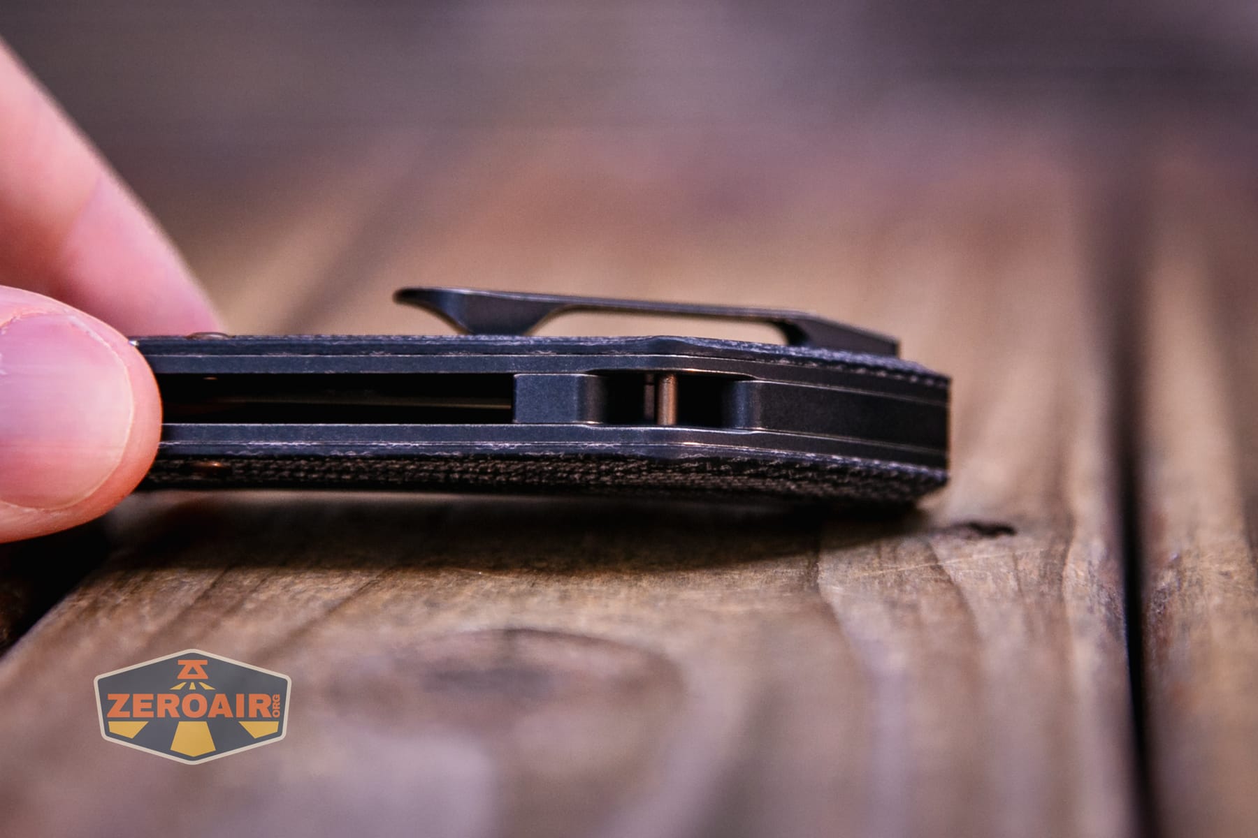 Kansept Pluto S90V knife lanyard area