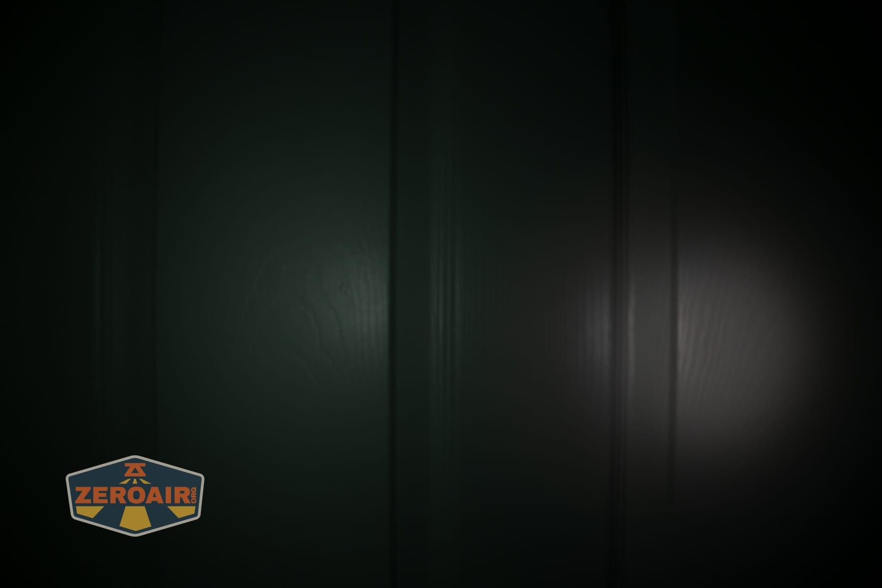 Nextorch eStar headlamp beamshots on door (at 1') compared to nichia 219b 4500K