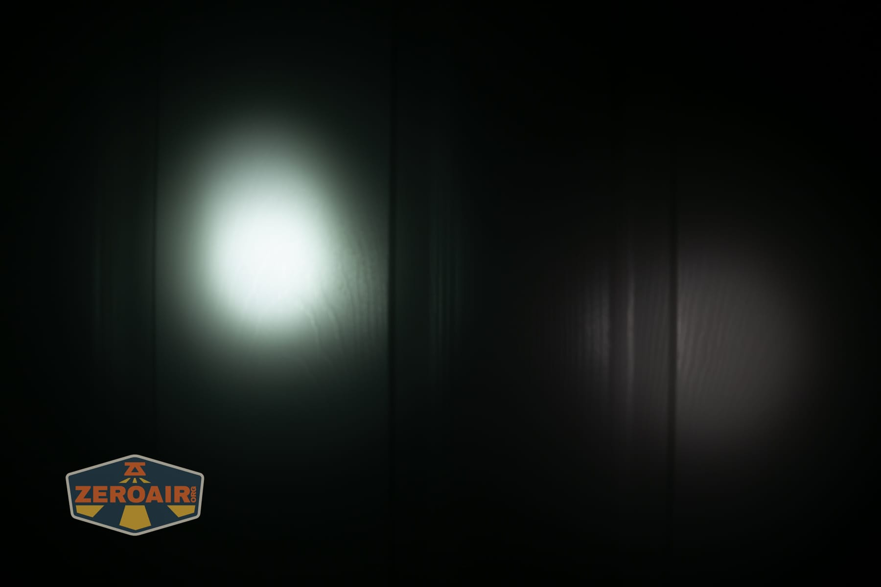 Nextorch eStar headlamp beamshots on door (at 1') compared to nichia 219b 4500K