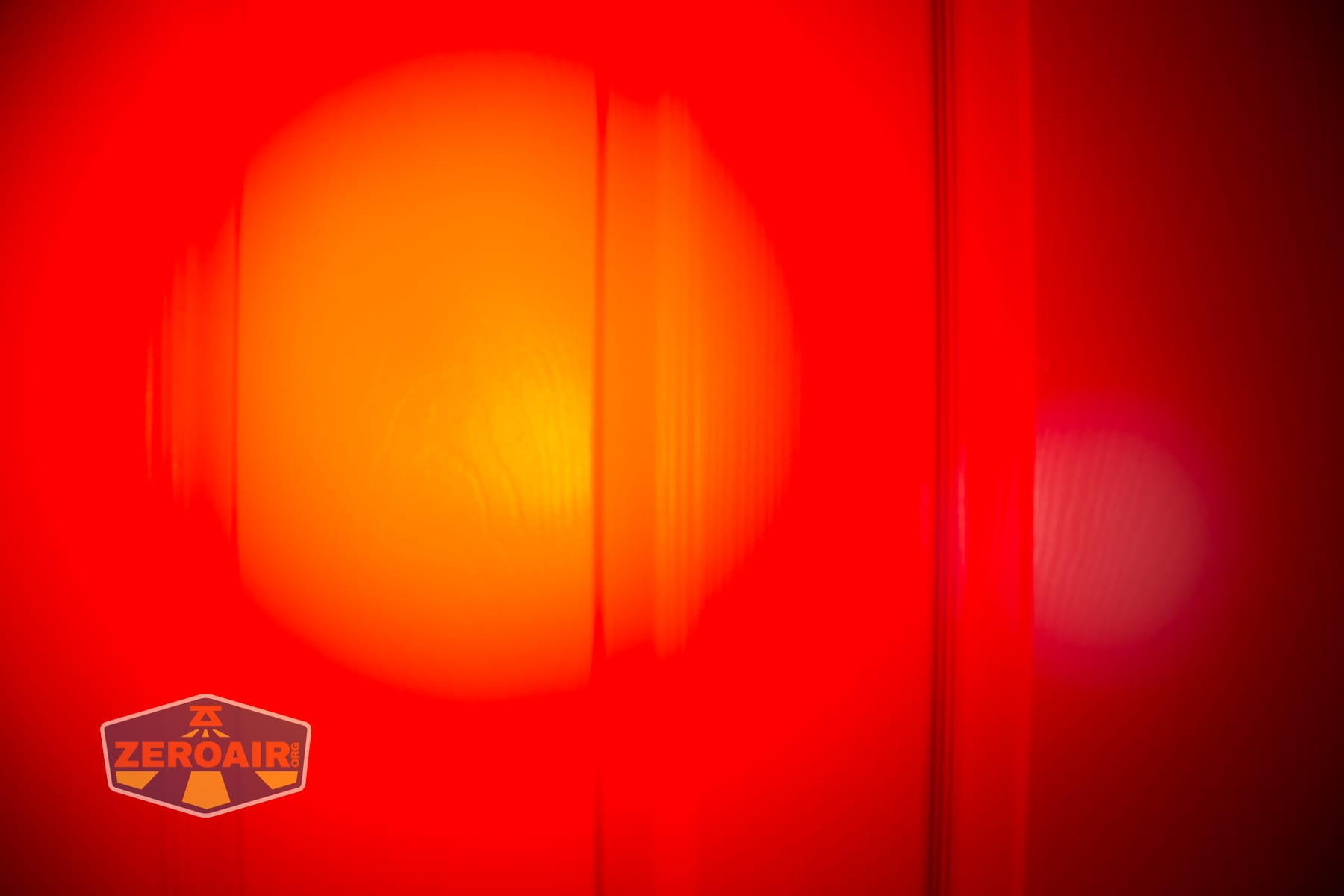 Nextorch eStar headlamp beamshots on door (at 1') compared to nichia 219b 4500K