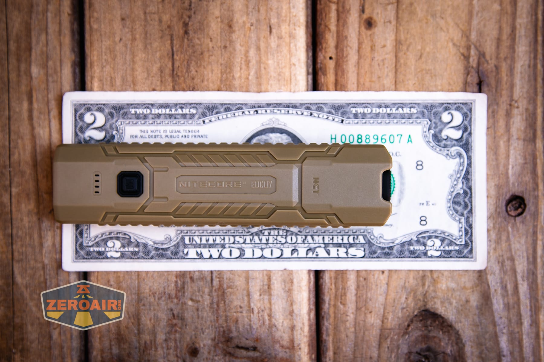 Nitecore EDC07 flashlight on a two dollar bill