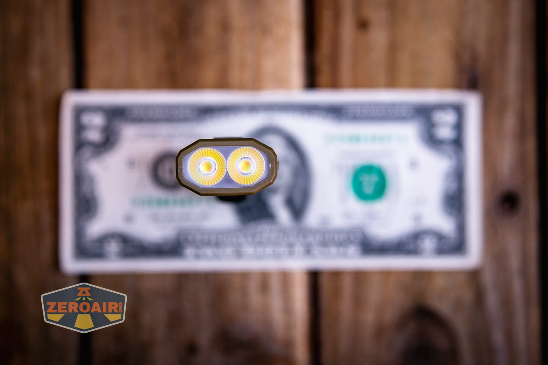 Nitecore EDC07 flashlight on a two dollar bill