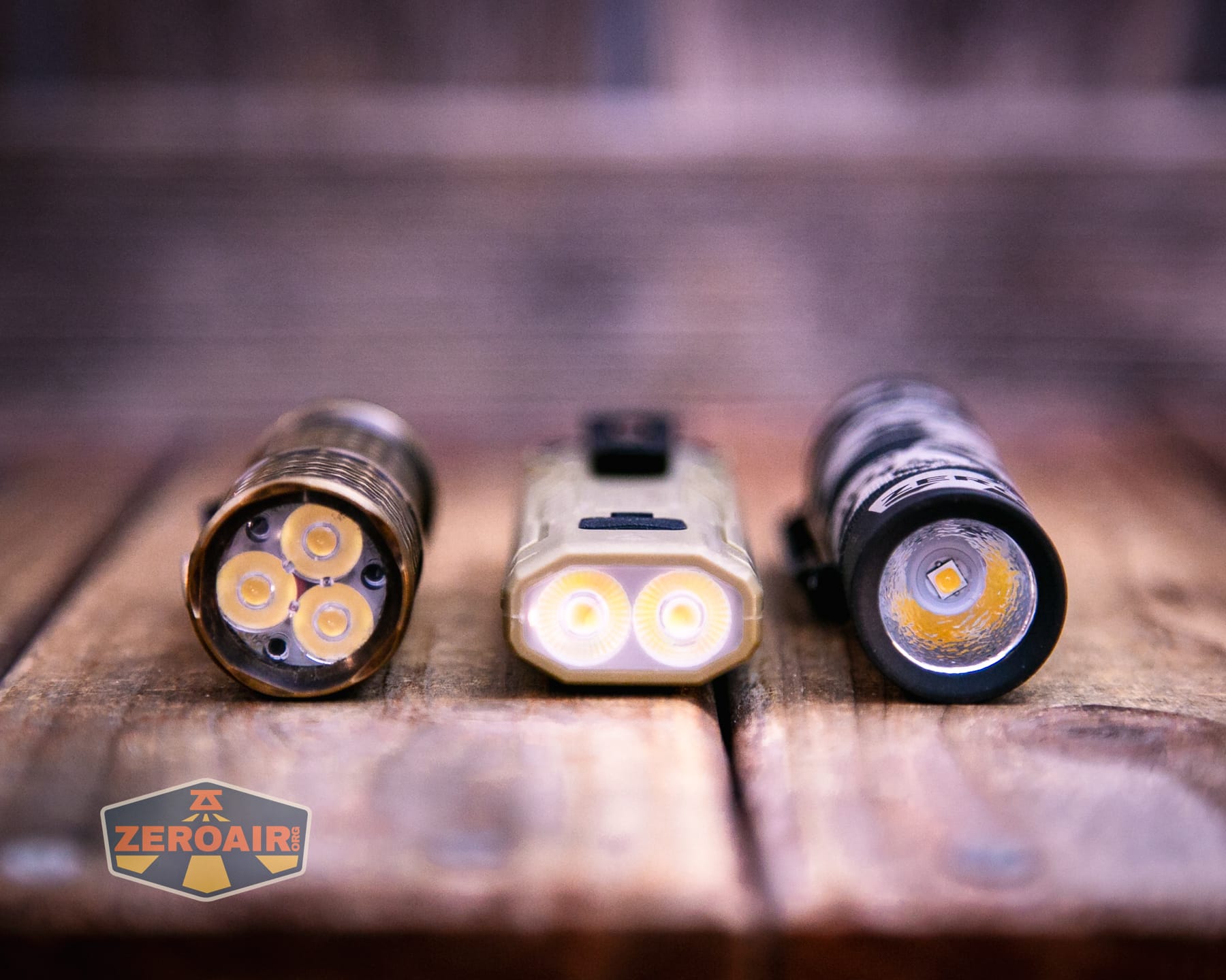 Nitecore EDC07 flashlight with two standard sized flashlights