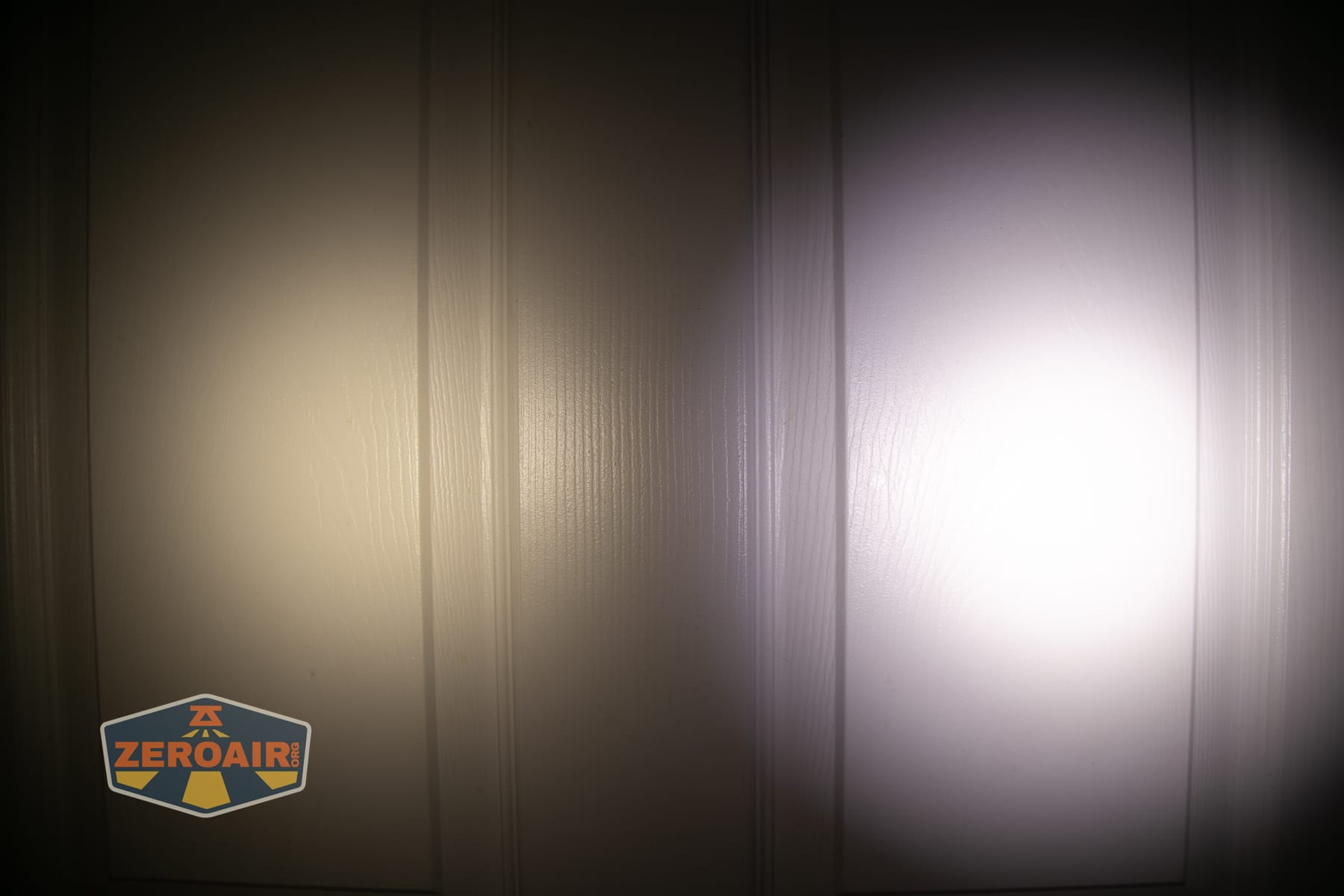 Nitecore EDC07 flashlight beamshots on door (at 1') compared to nichia 219b 4500K