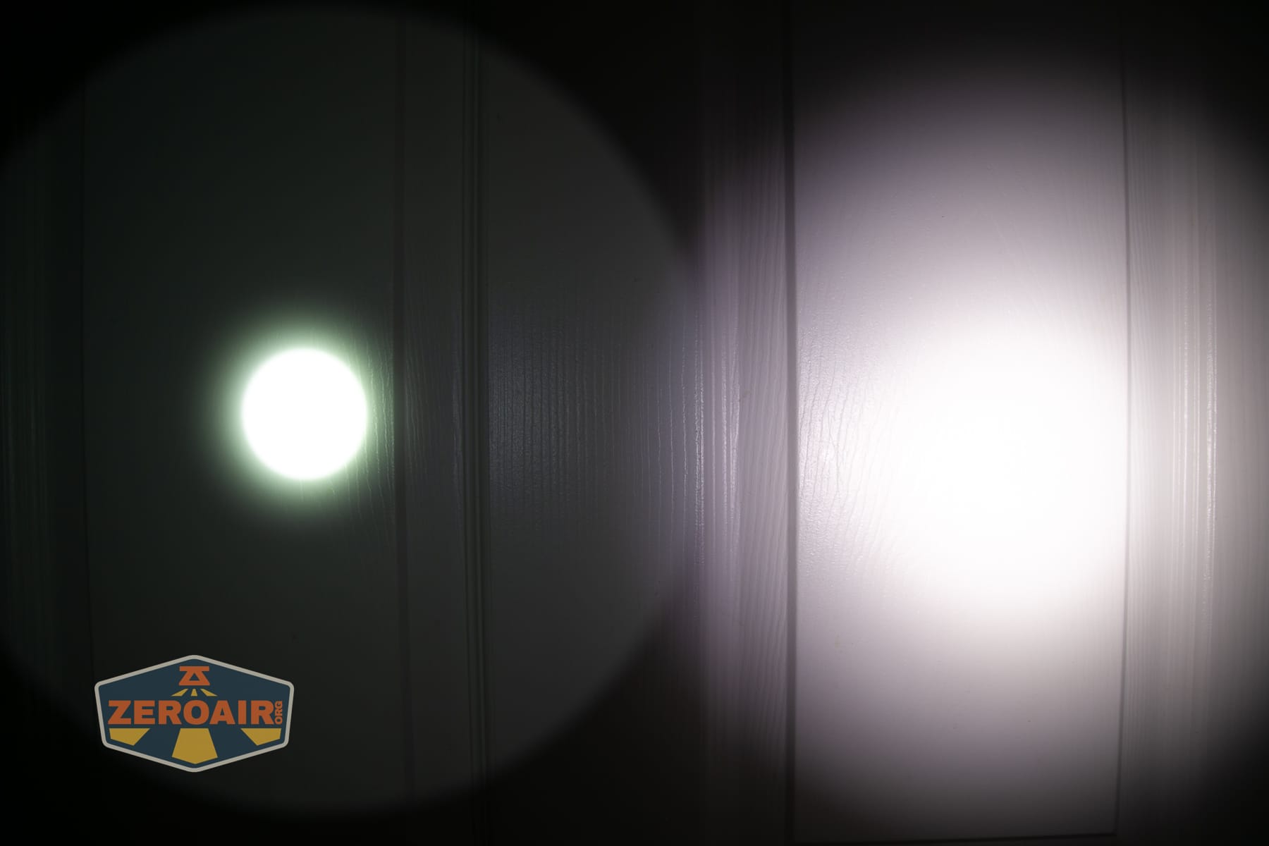 SPERAS T217 V3 Long Range Hunting flashlight beamshots on door compared to nichia 219b