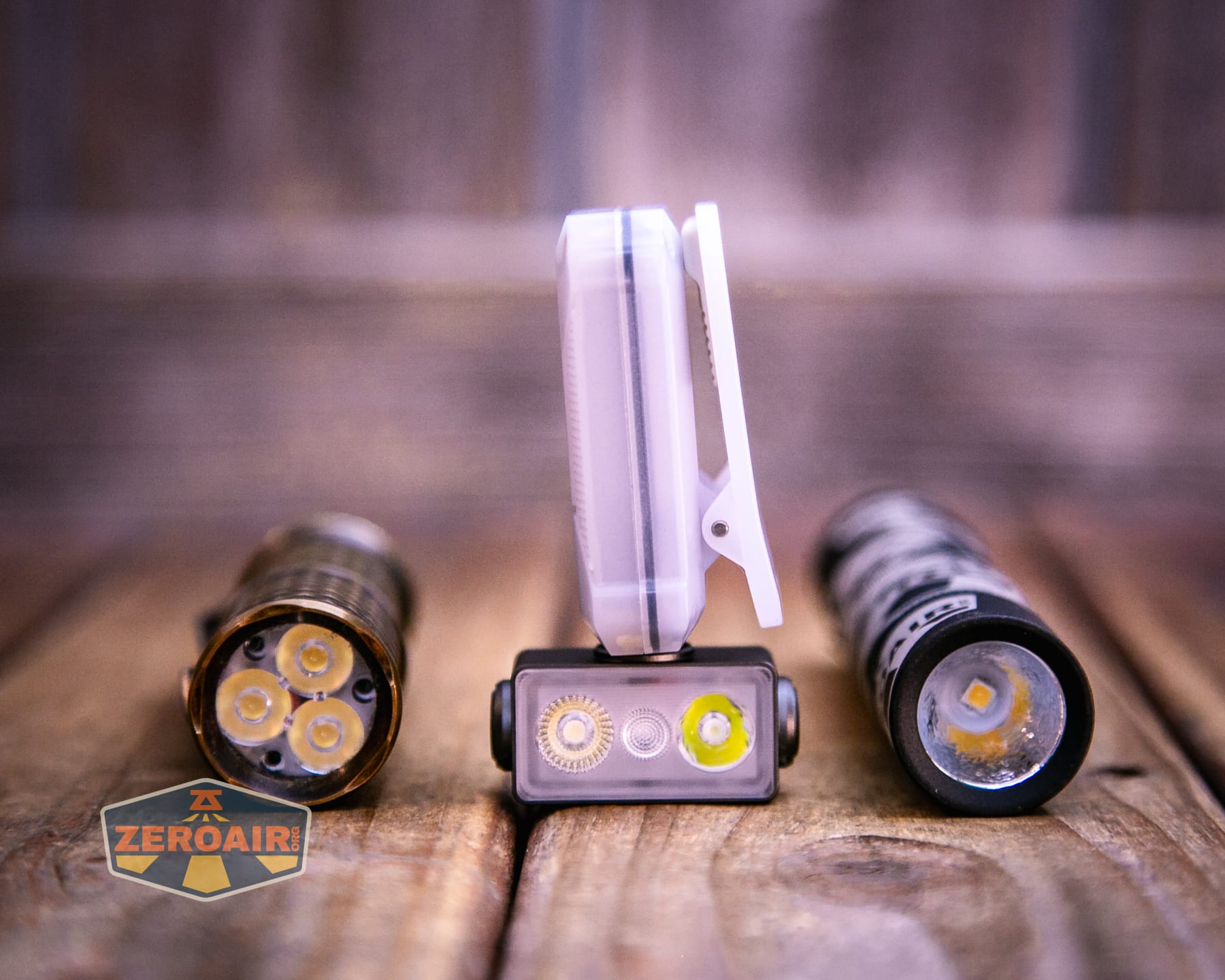 Wurkkos HD04 pocket flashlight with two standard sized flashlights