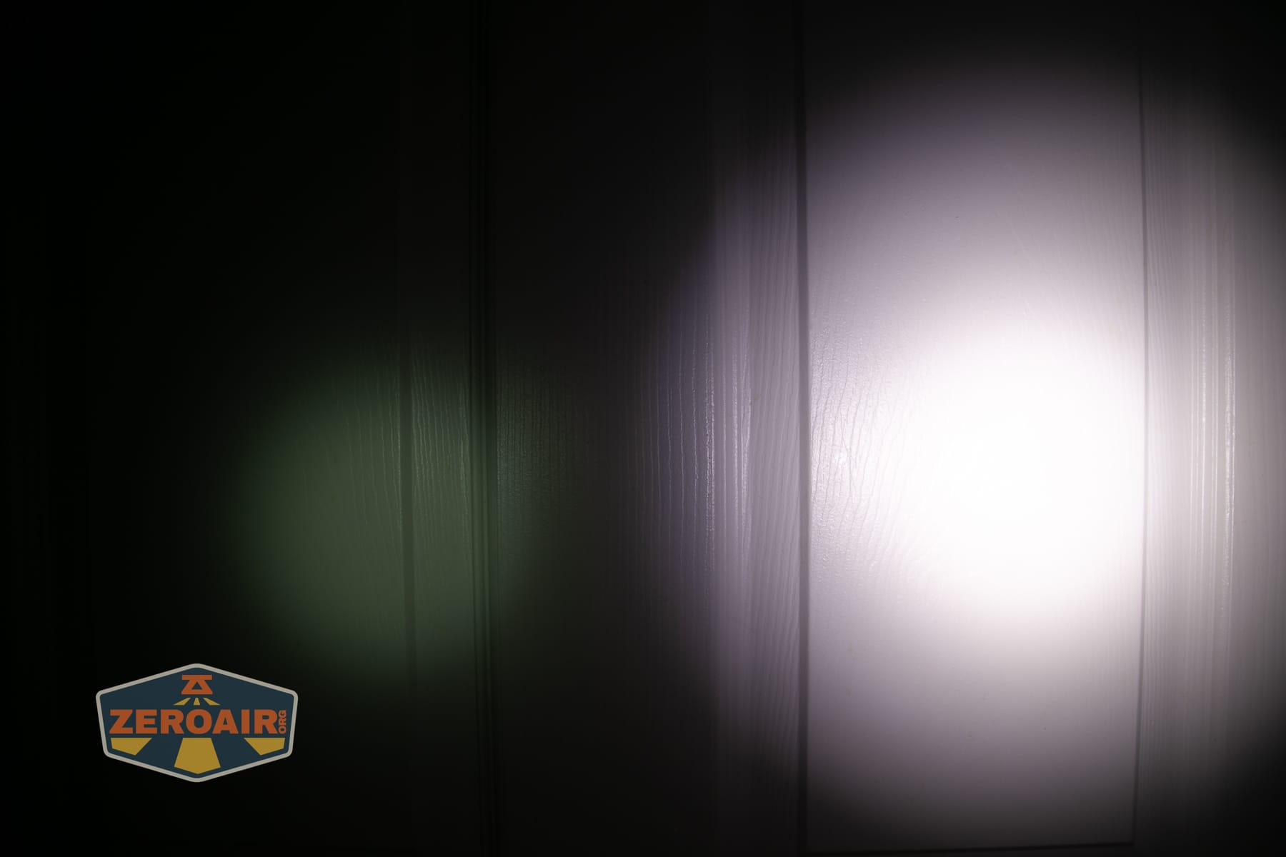 Wurkkos HD04 pocket flashlight beamshots on door (at 1') compared to nichia 219b 4500K