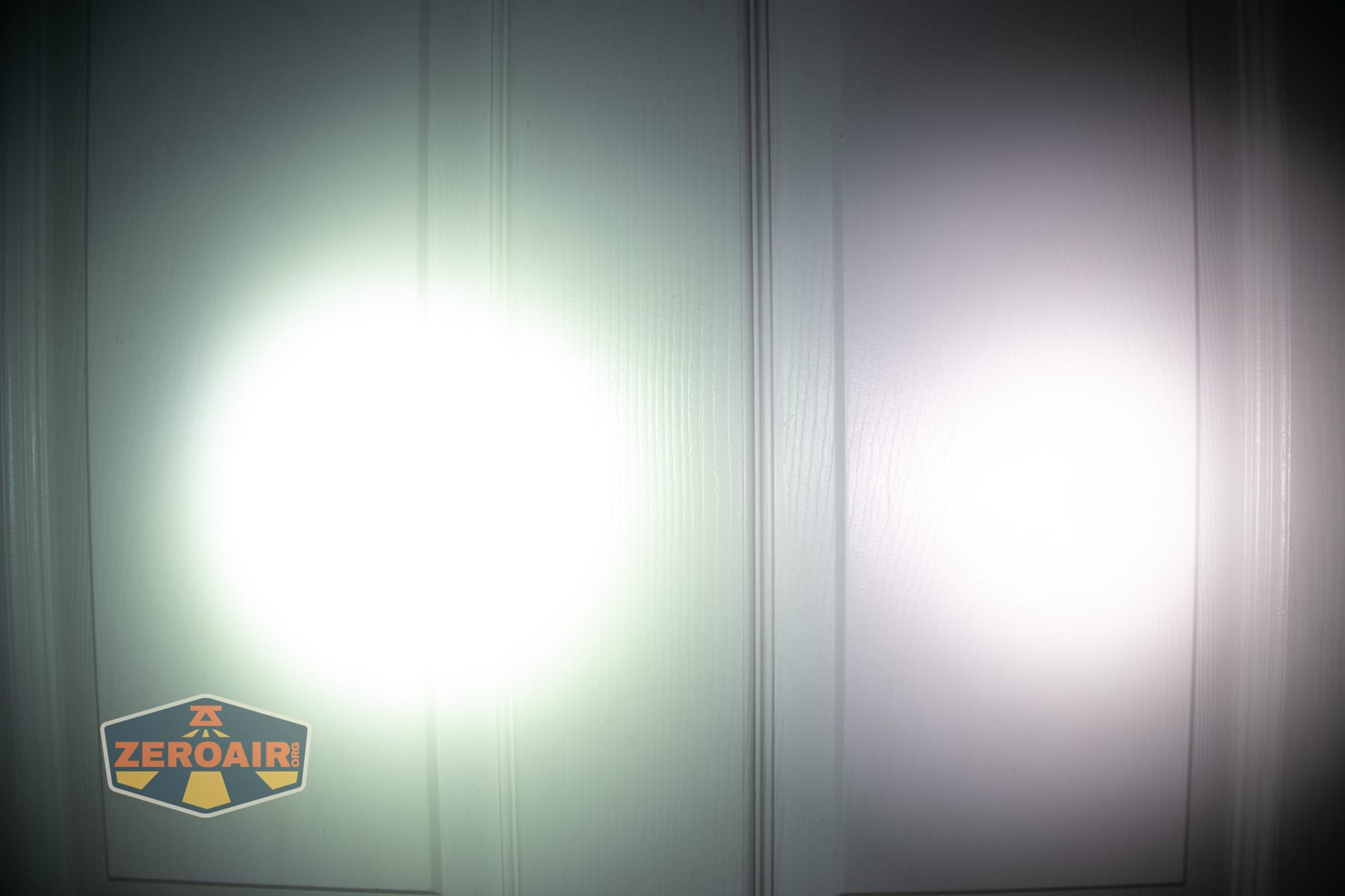 Wurkkos HD04 pocket flashlight beamshots on door (at 1') compared to nichia 219b 4500K