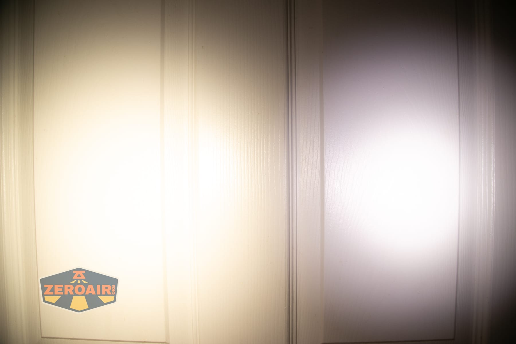 Wurkkos HD04 pocket flashlight beamshots on door (at 1') compared to nichia 219b 4500K