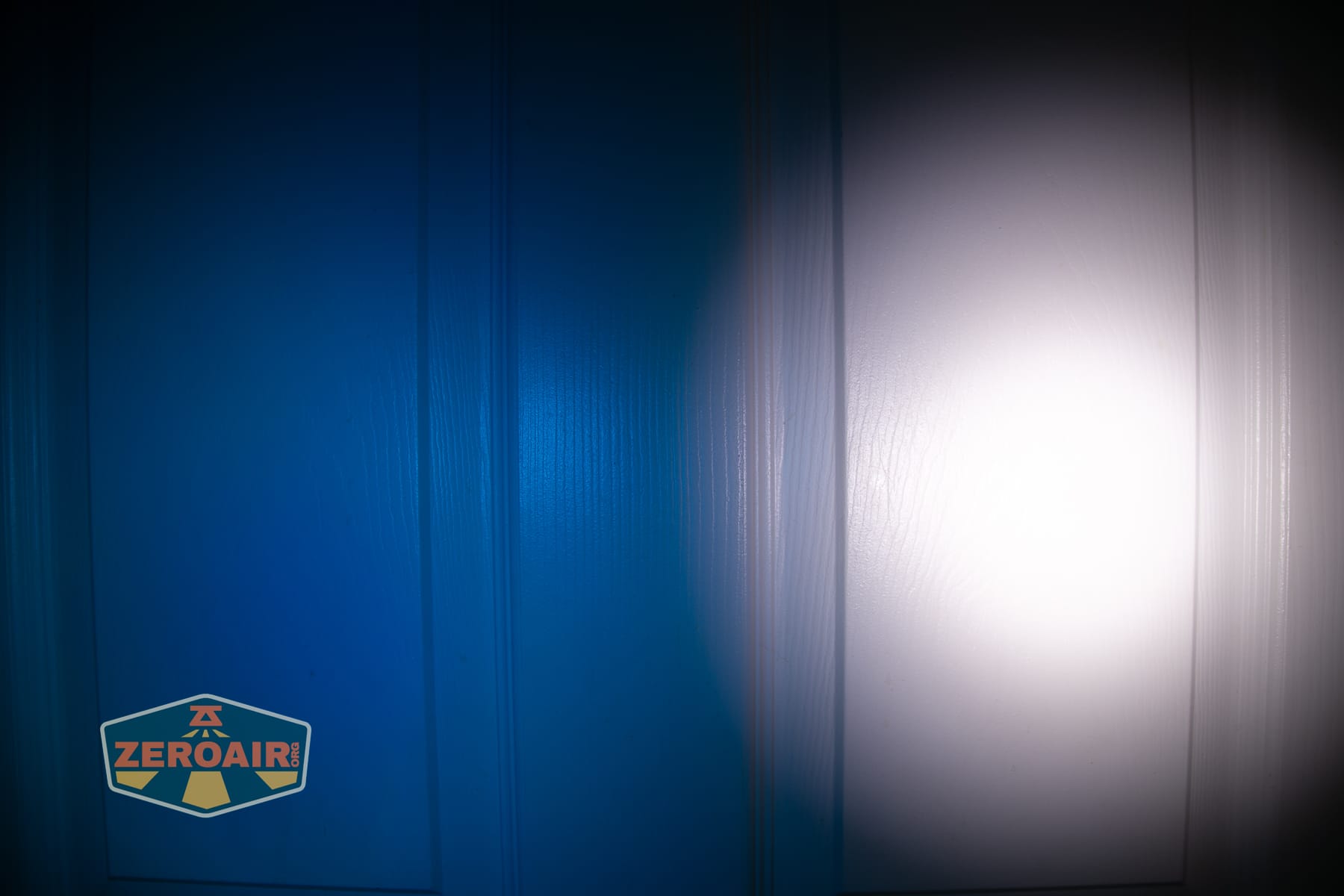 Wurkkos HD04 pocket flashlight beamshots on door (at 1') compared to nichia 219b 4500K
