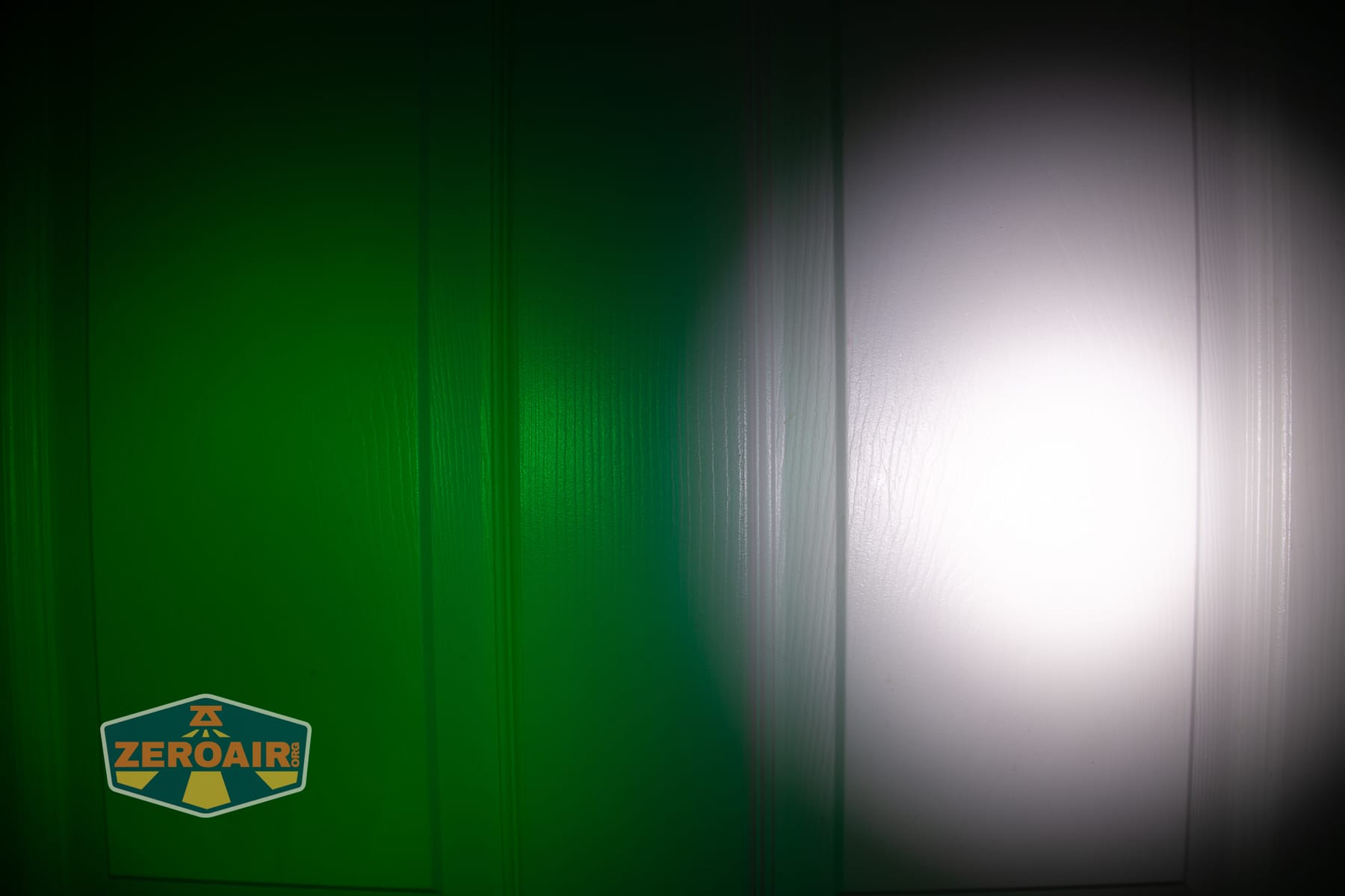 Wurkkos HD04 pocket flashlight beamshots on door (at 1') compared to nichia 219b 4500K