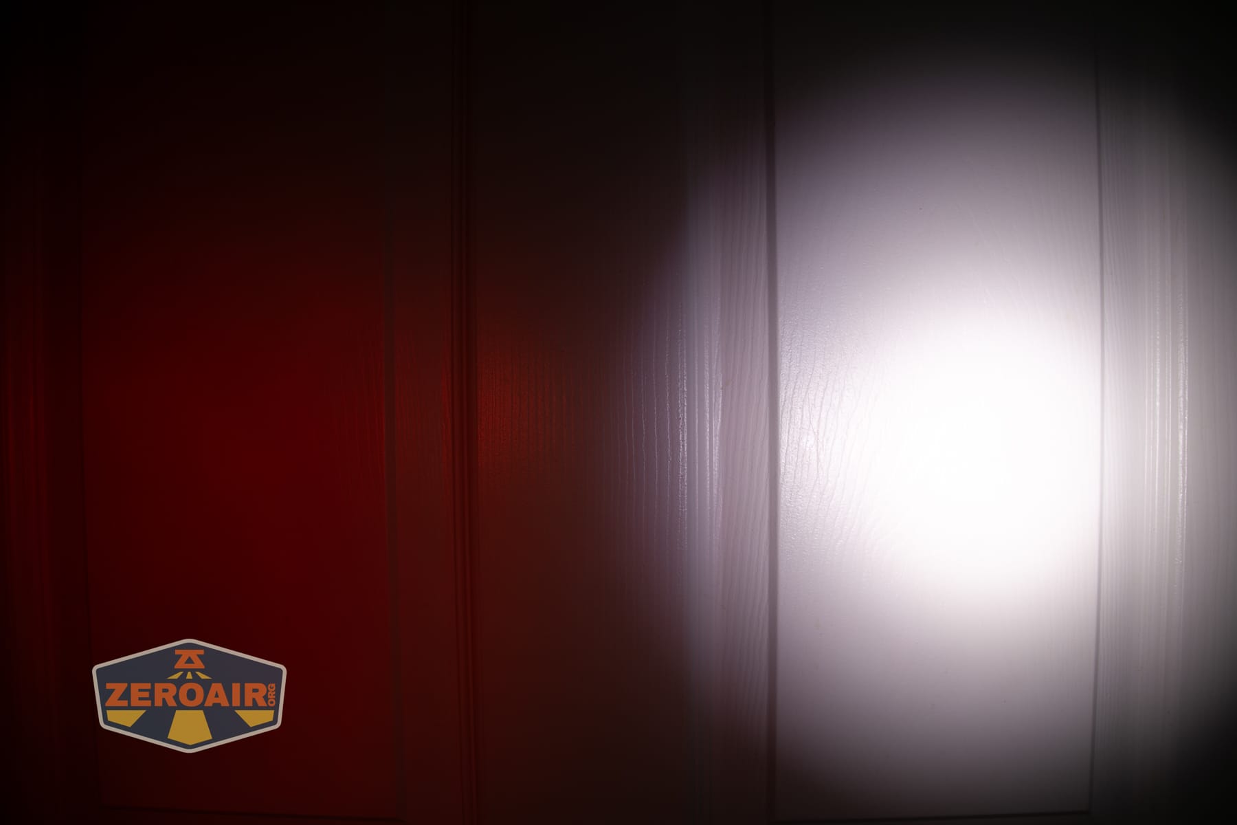 Wurkkos HD04 pocket flashlight beamshots on door (at 1') compared to nichia 219b 4500K
