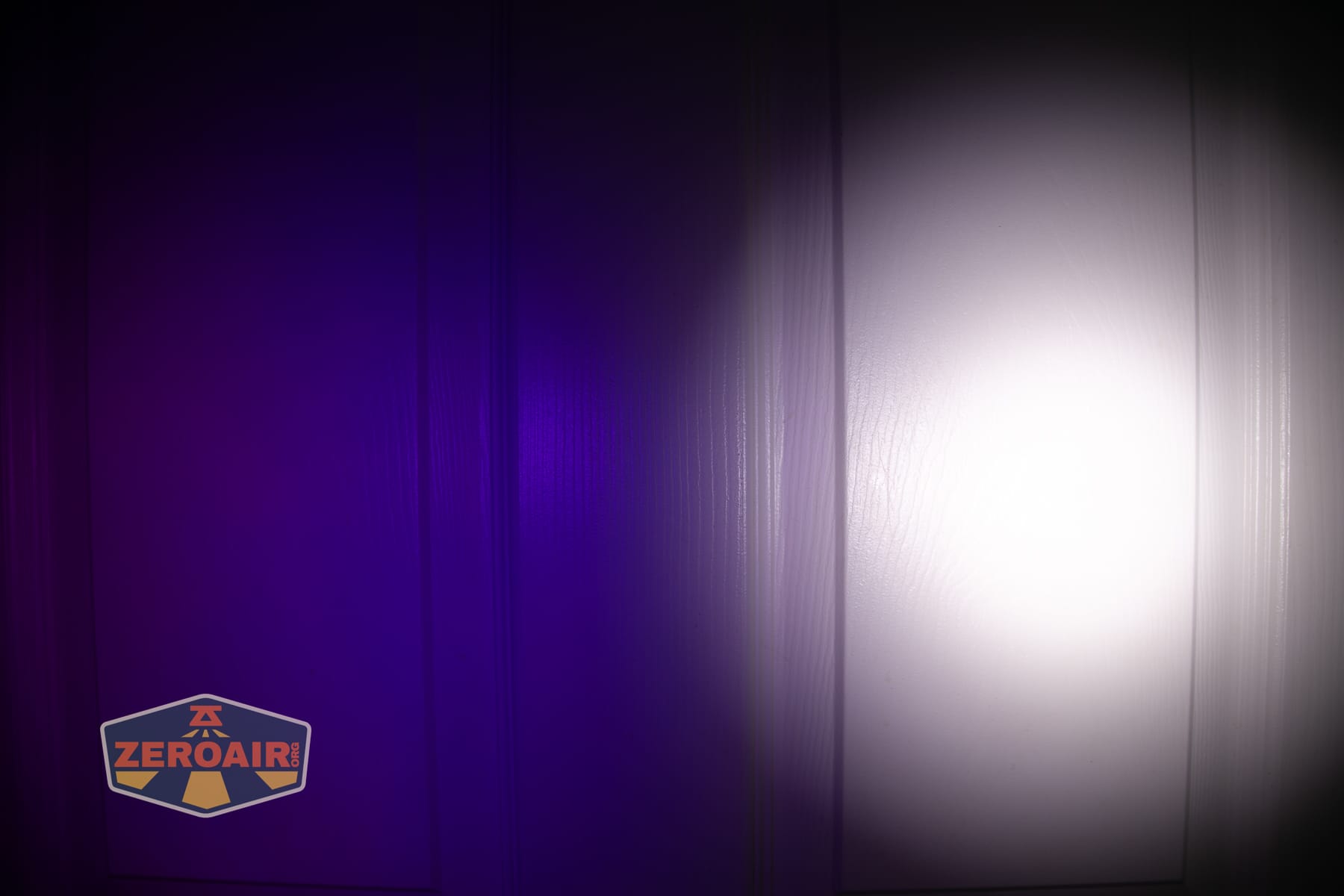 Wurkkos HD04 pocket flashlight beamshots on door (at 1') compared to nichia 219b 4500K