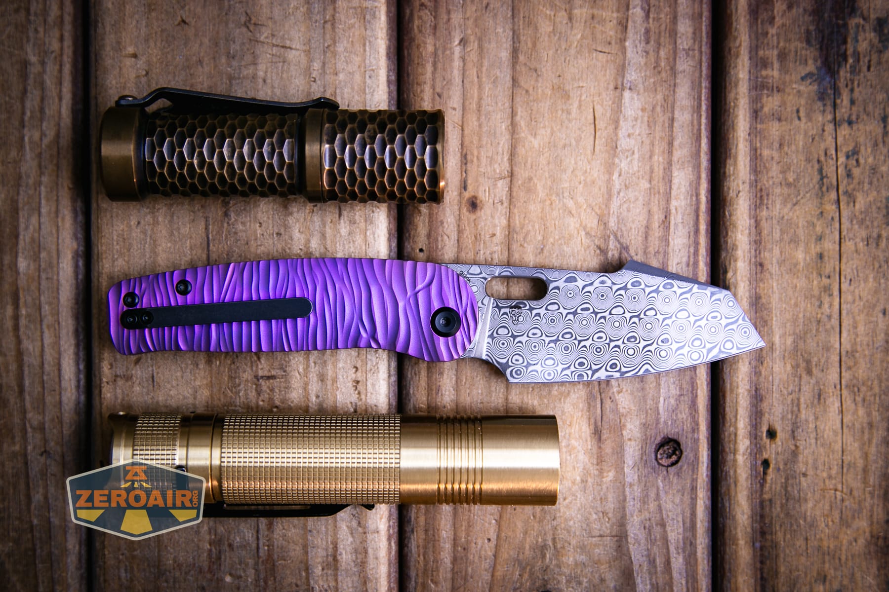 Kansept Orlok knife with two standard sized flashlights