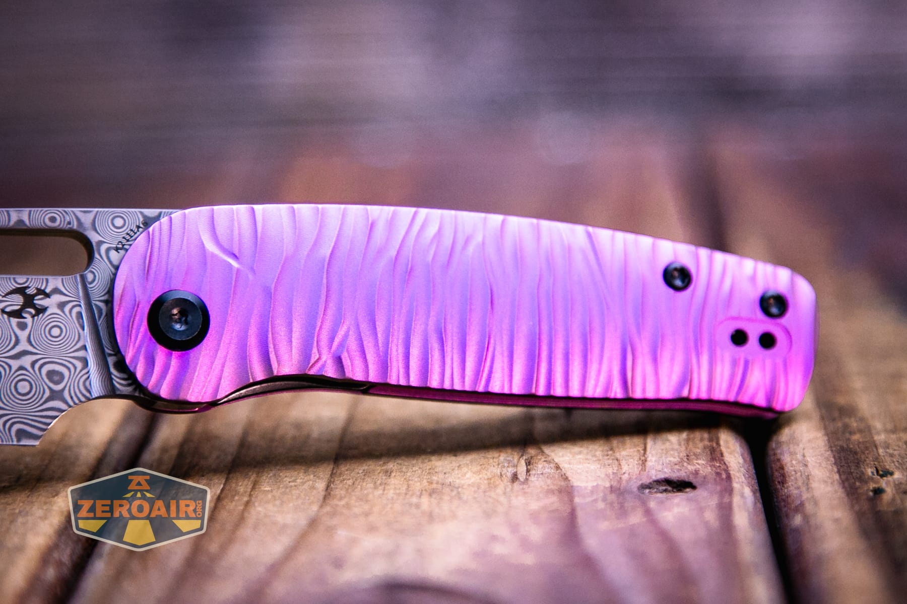 Kansept Orlok knife handle purple sheen