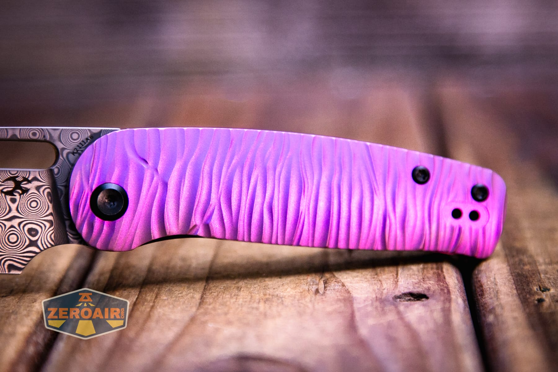 Kansept Orlok knife handle purple sheen