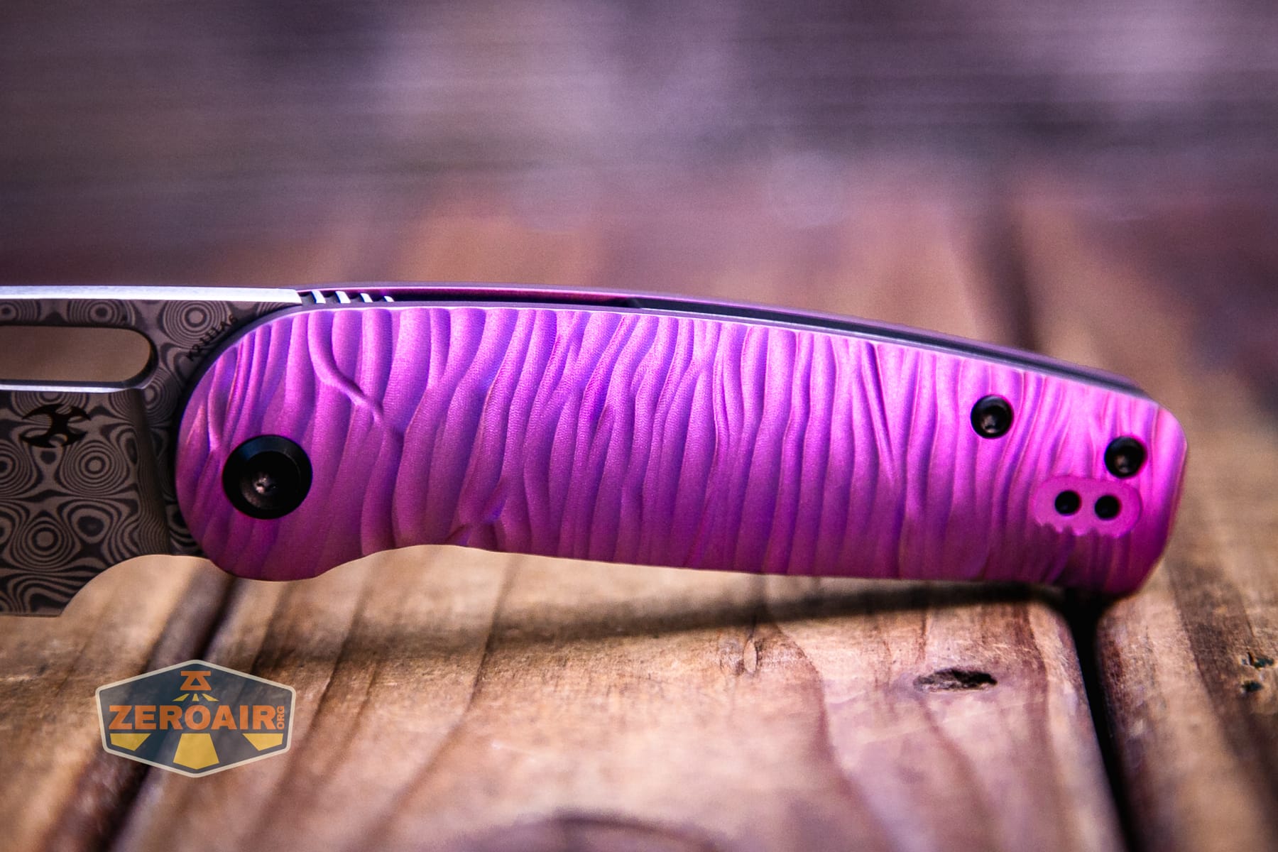 Kansept Orlok knife handle purple sheen