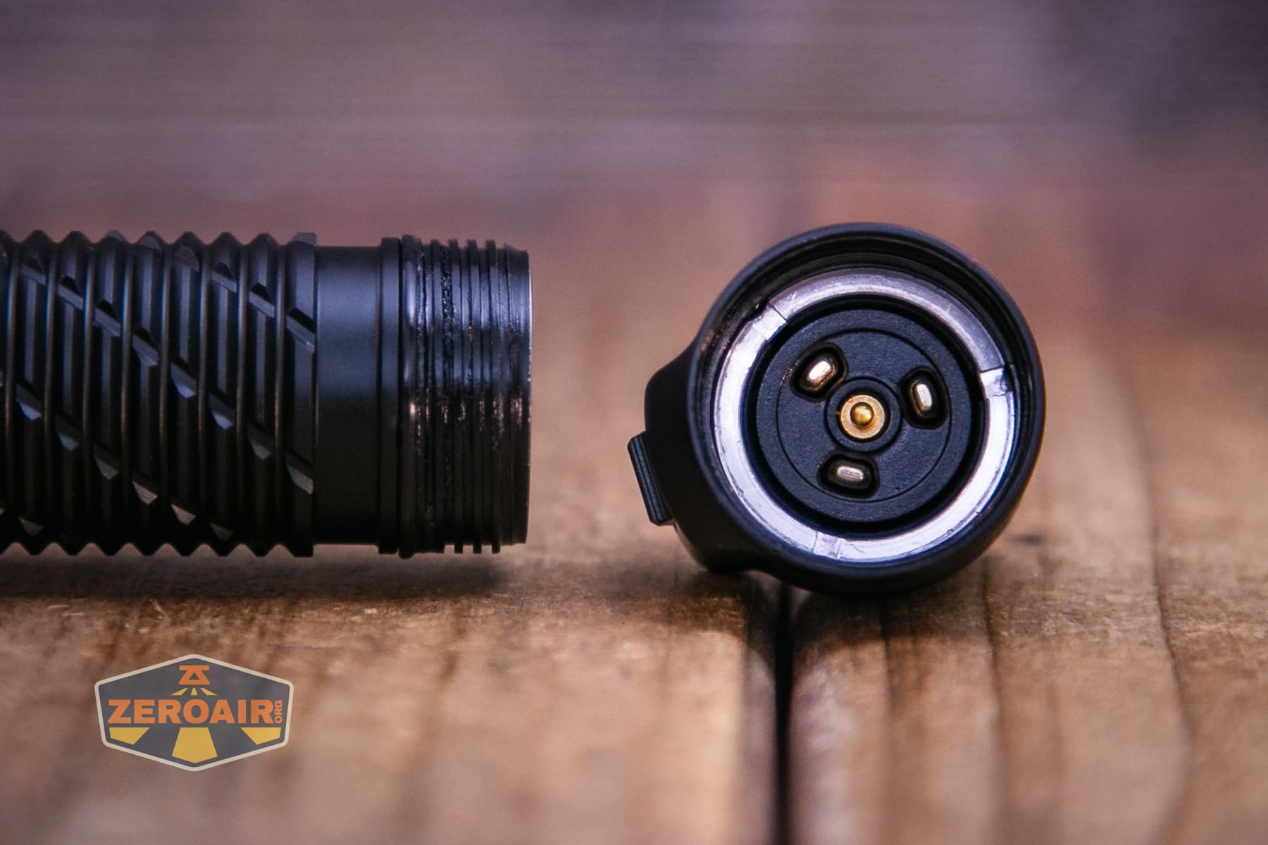 Nitecore P27iX customizable tactical flashlight showing tail contacts