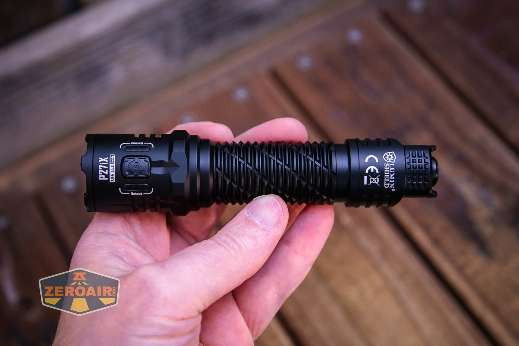 Nitecore P27iX customizable tactical flashlight in hand