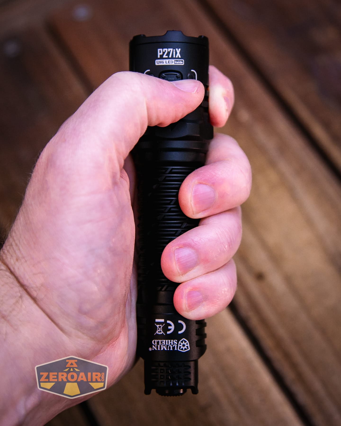 Nitecore P27iX customizable tactical flashlight in hand