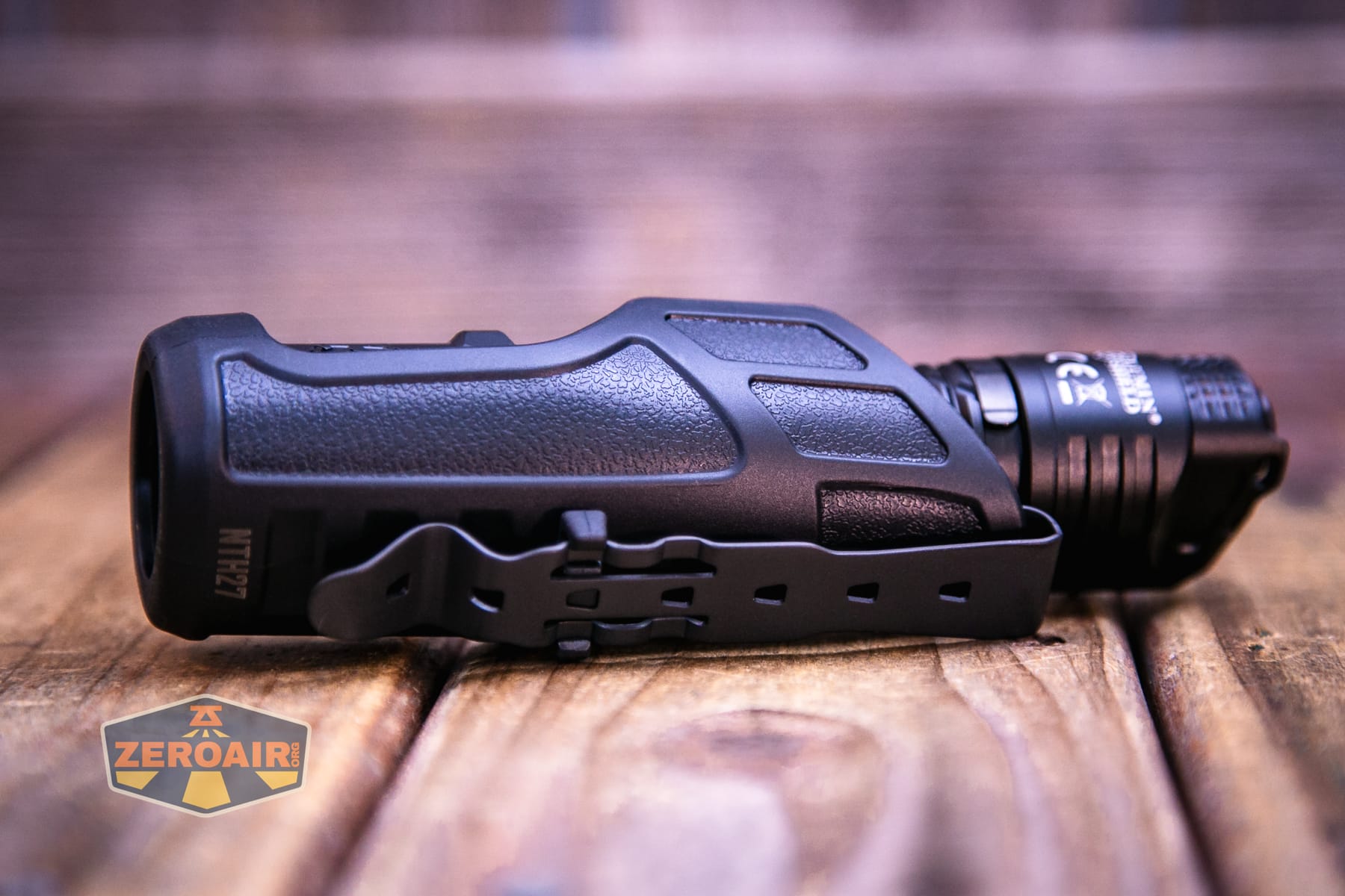 Nitecore P27iX customizable tactical flashlight in holster