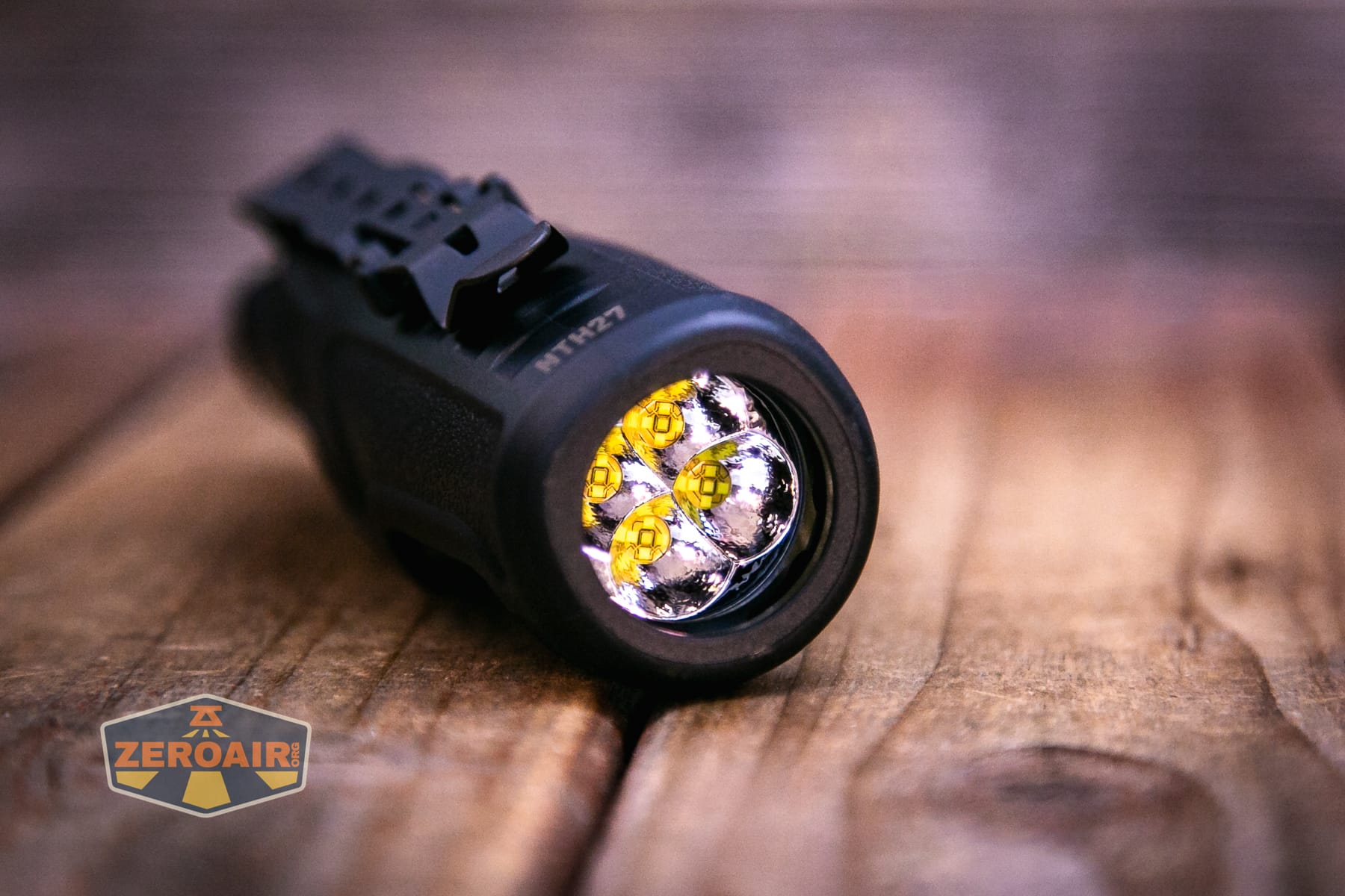 Nitecore P27iX customizable tactical flashlight in holster