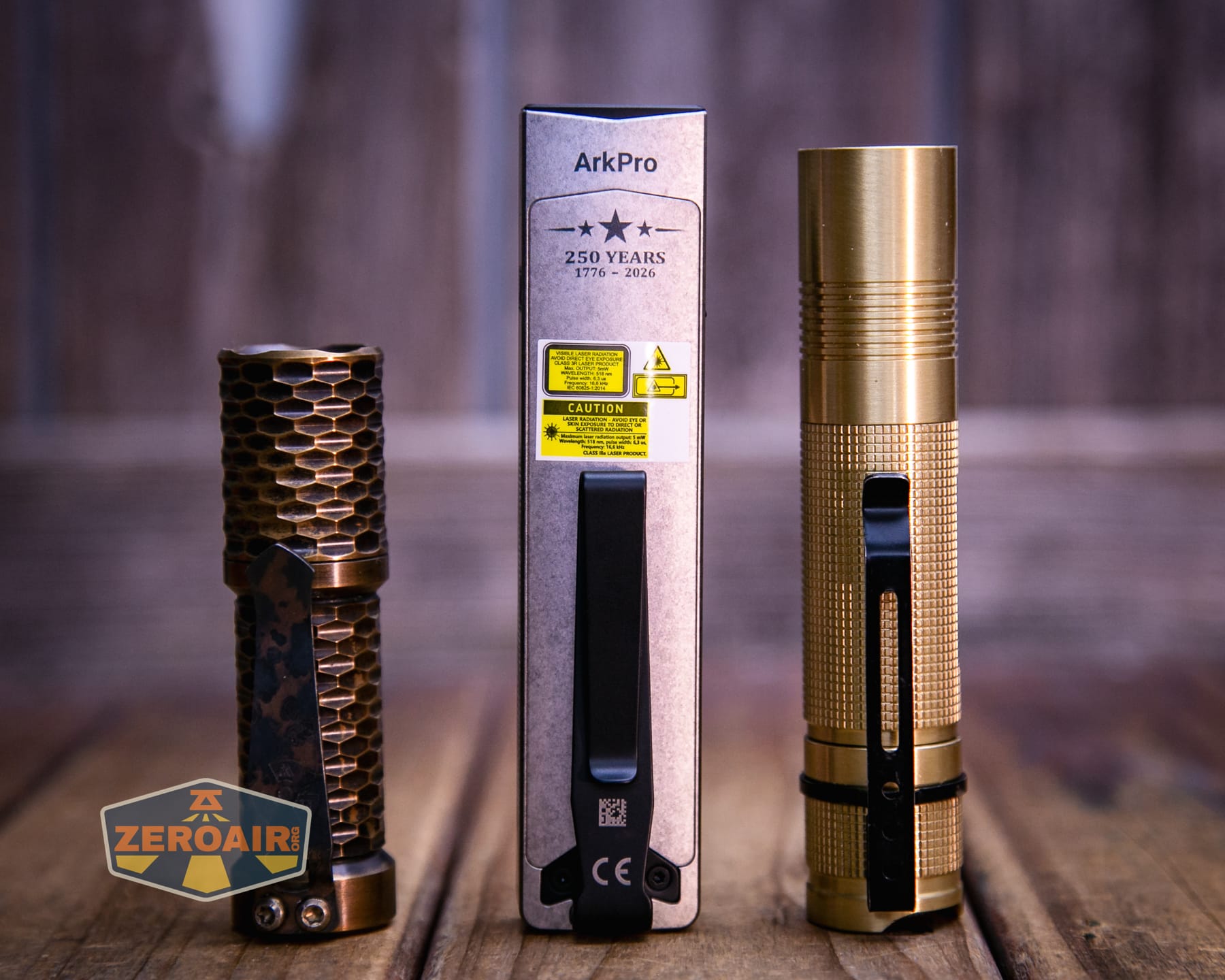 Olight Arkpro Stars and Stripes flat flashlight with standard sized flashlights
