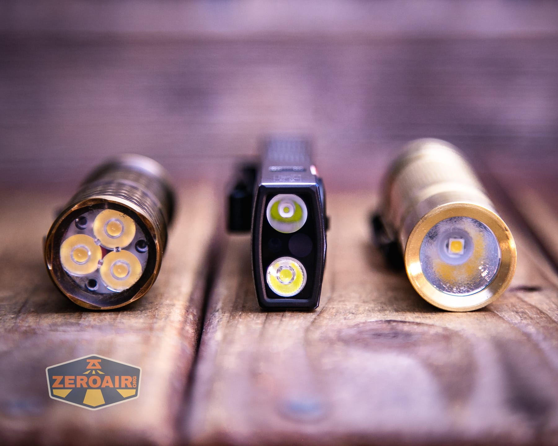 Olight Arkpro Stars and Stripes flat flashlight with standard sized flashlights