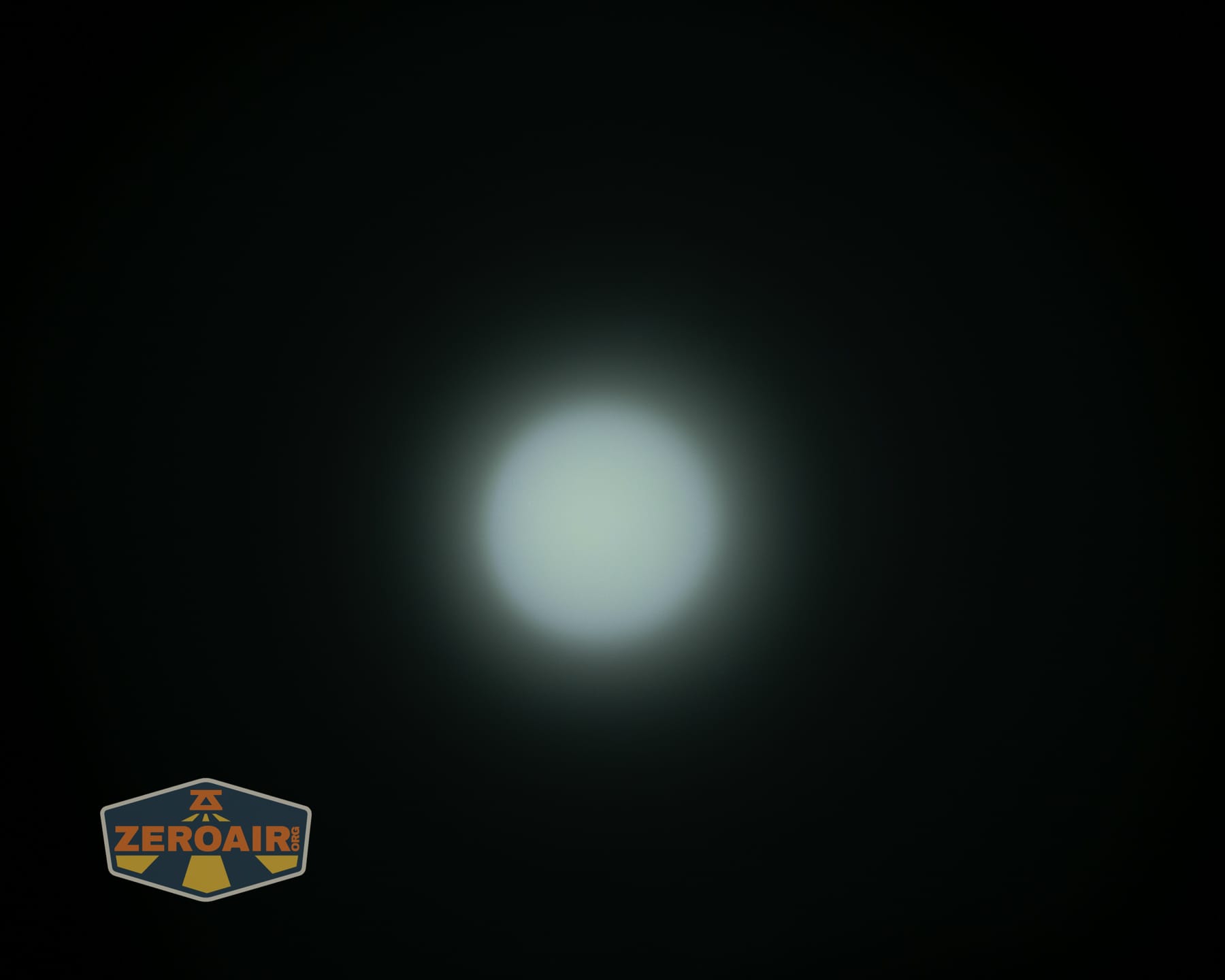 Olight Arkpro Stars and Stripes flat flashlight beamshots on ceiling