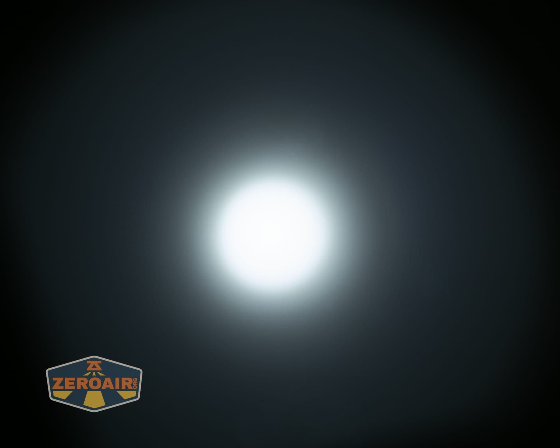 Olight Arkpro Stars and Stripes flat flashlight beamshots on ceiling