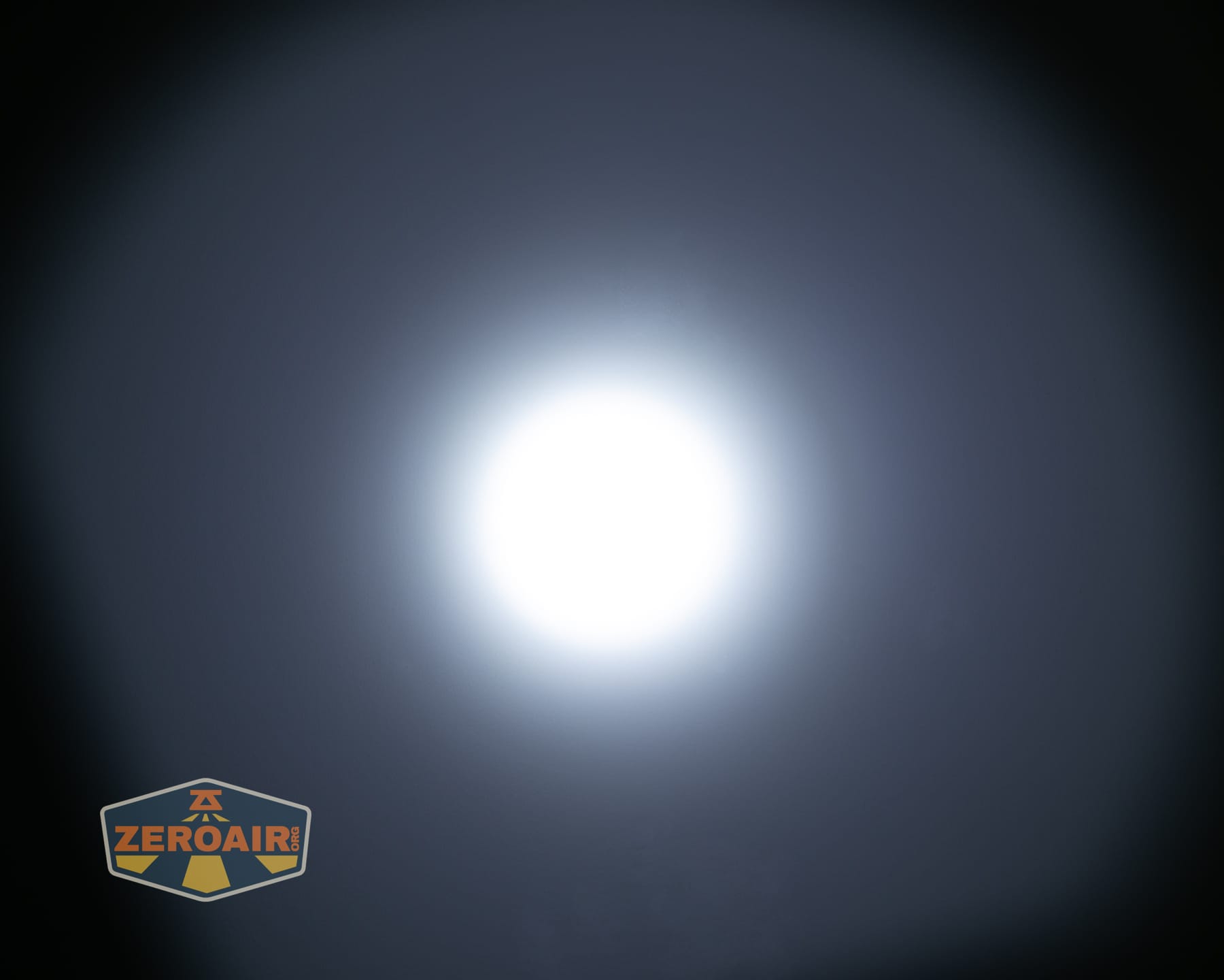 Olight Arkpro Stars and Stripes flat flashlight beamshots on ceiling