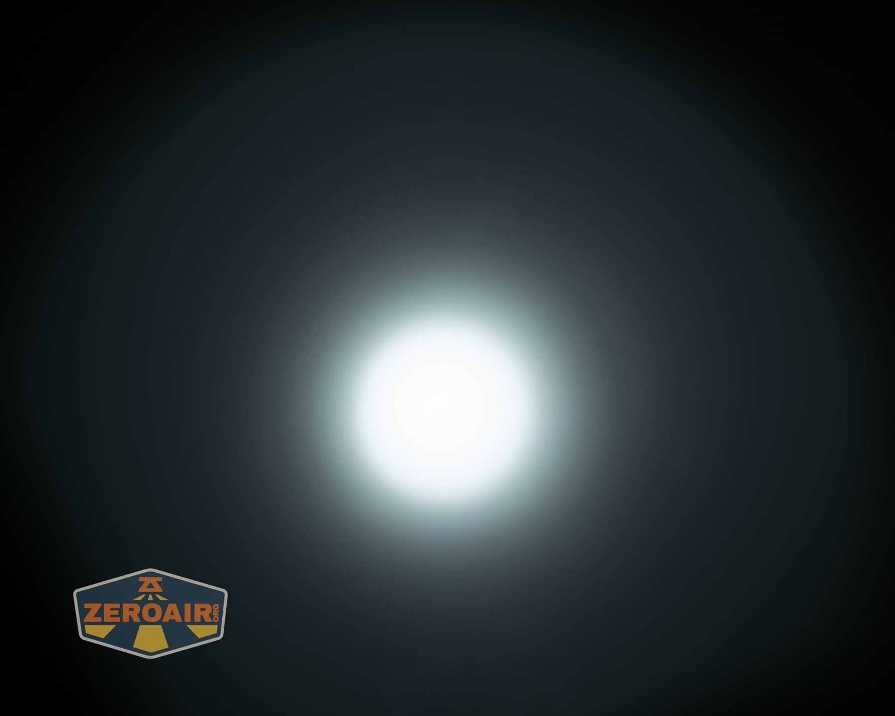 Olight Arkpro Stars and Stripes flat flashlight beamshots on ceiling