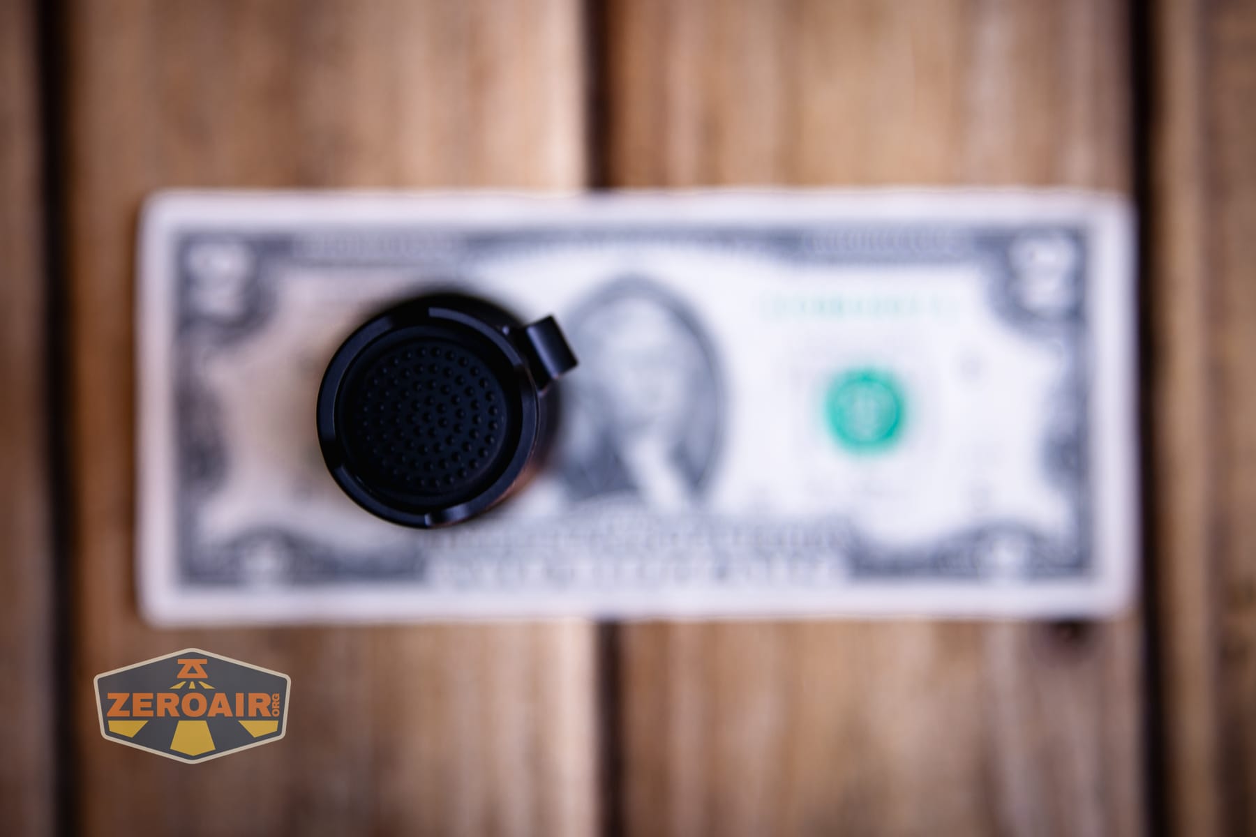 Speras EST PLUS V3 flashlight on a two dollar bill