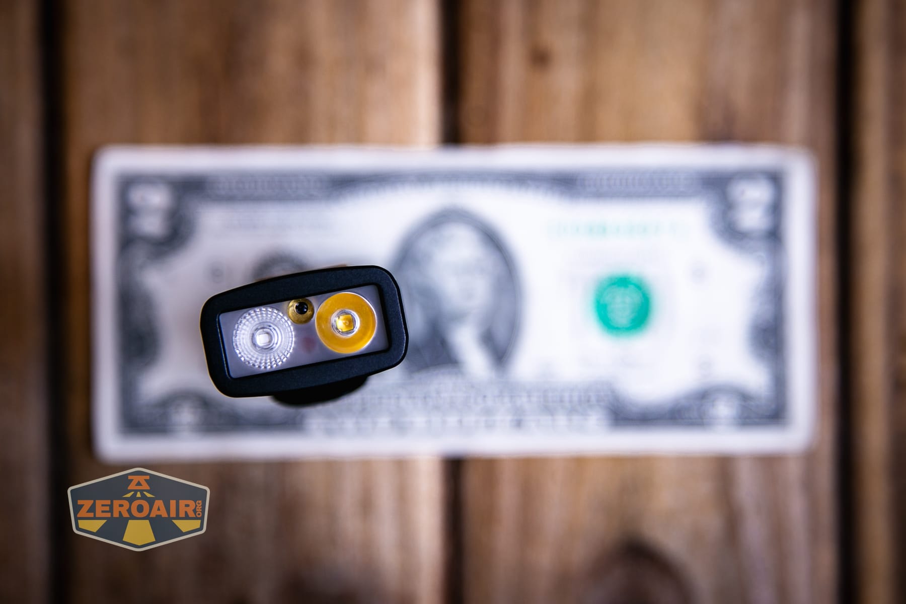 Vezerlezer WK2 flat flashlight on a two dollar bill
