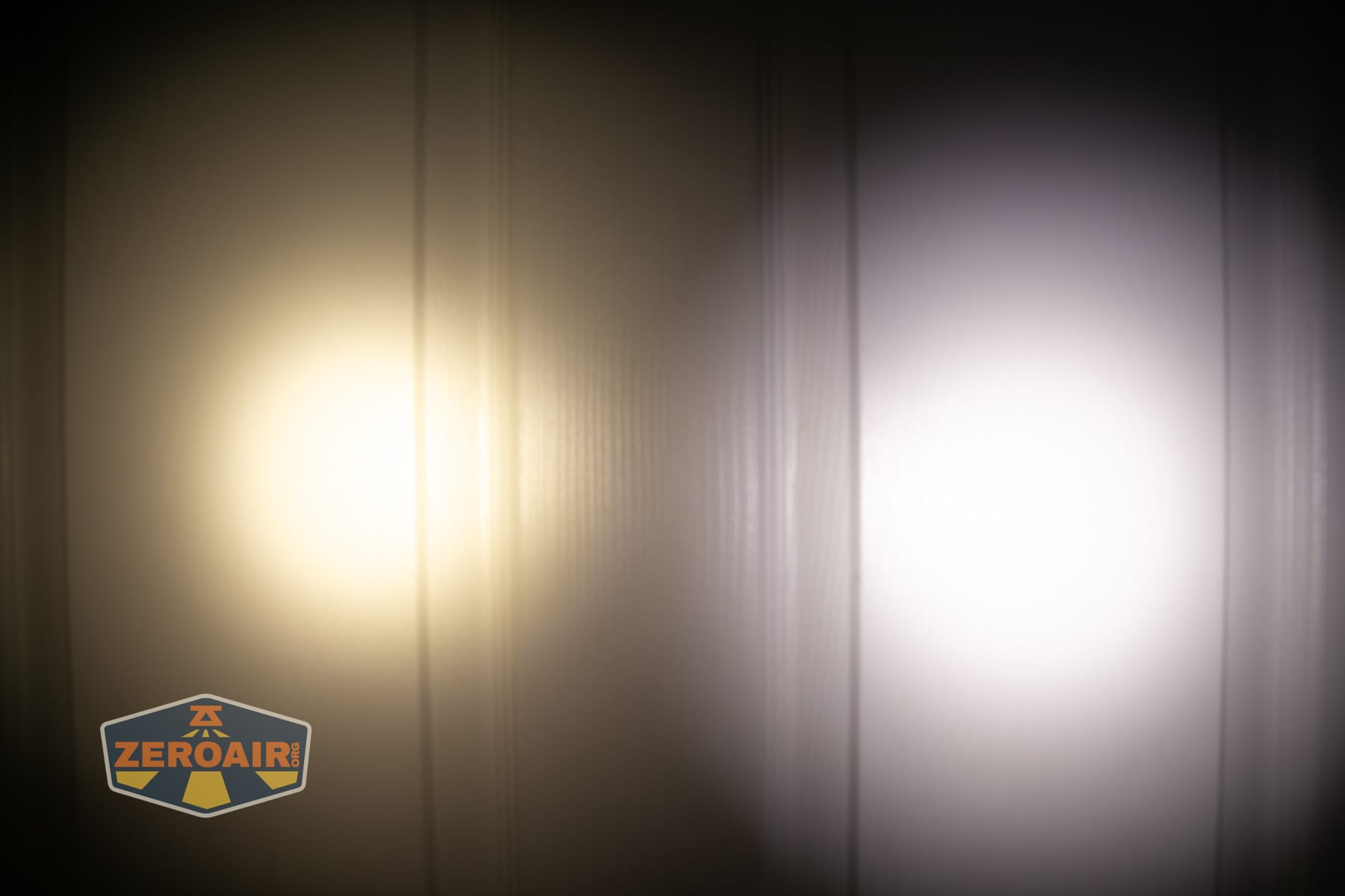 Vezerlezer WK2 flat flashlight beamshots on door (at 1') compared to nichia 219b 4500K