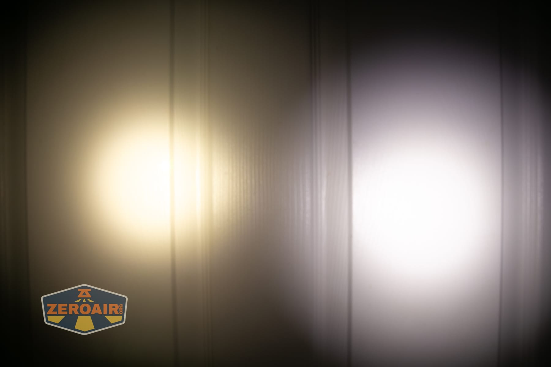 Vezerlezer WK2 flat flashlight beamshots on door (at 1') compared to nichia 219b 4500K