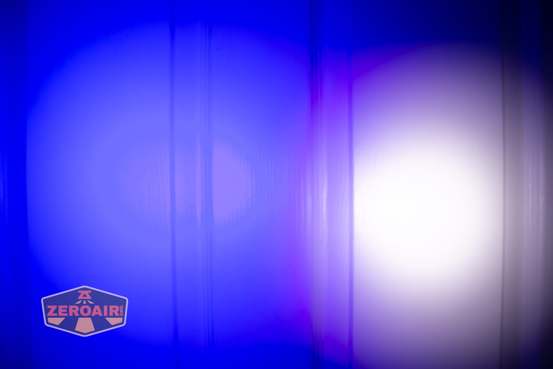 Vezerlezer WK2 flat flashlight beamshots on door (at 1') compared to nichia 219b 4500K