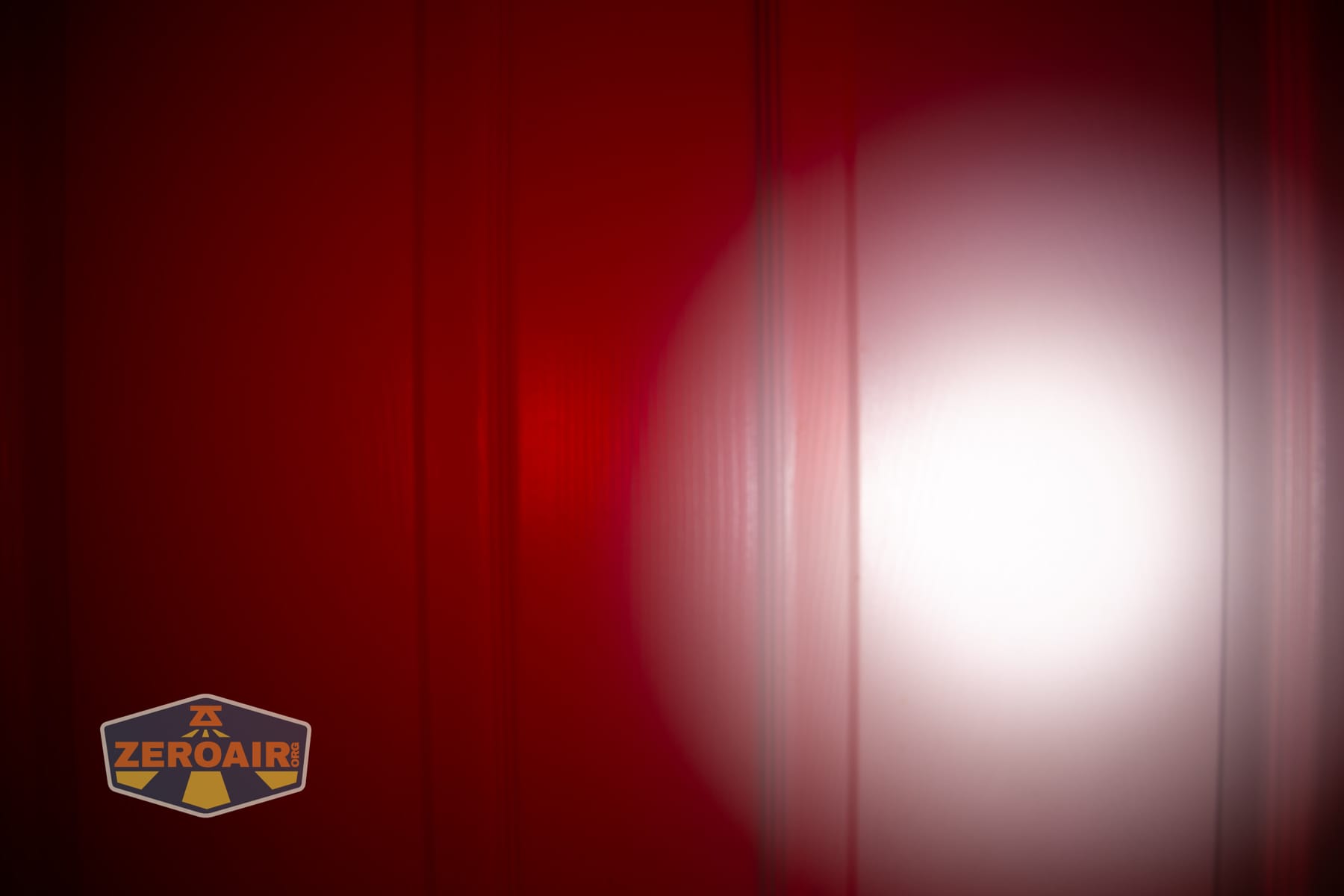 Vezerlezer WK2 flat flashlight beamshots on door (at 1') compared to nichia 219b 4500K