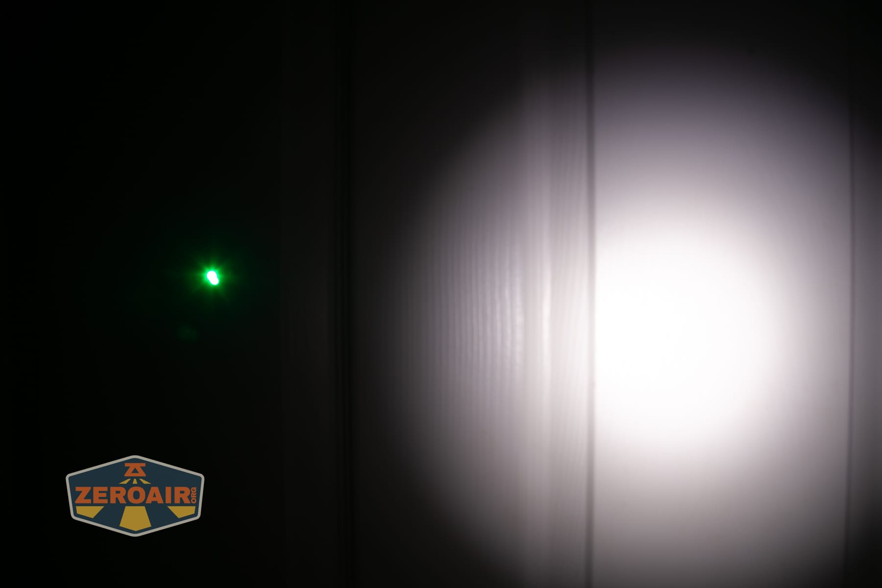 Wuben X5 3-in-1 compact EDC flashlight beamshots on door (at 1') compared to nichia 219b 4500K