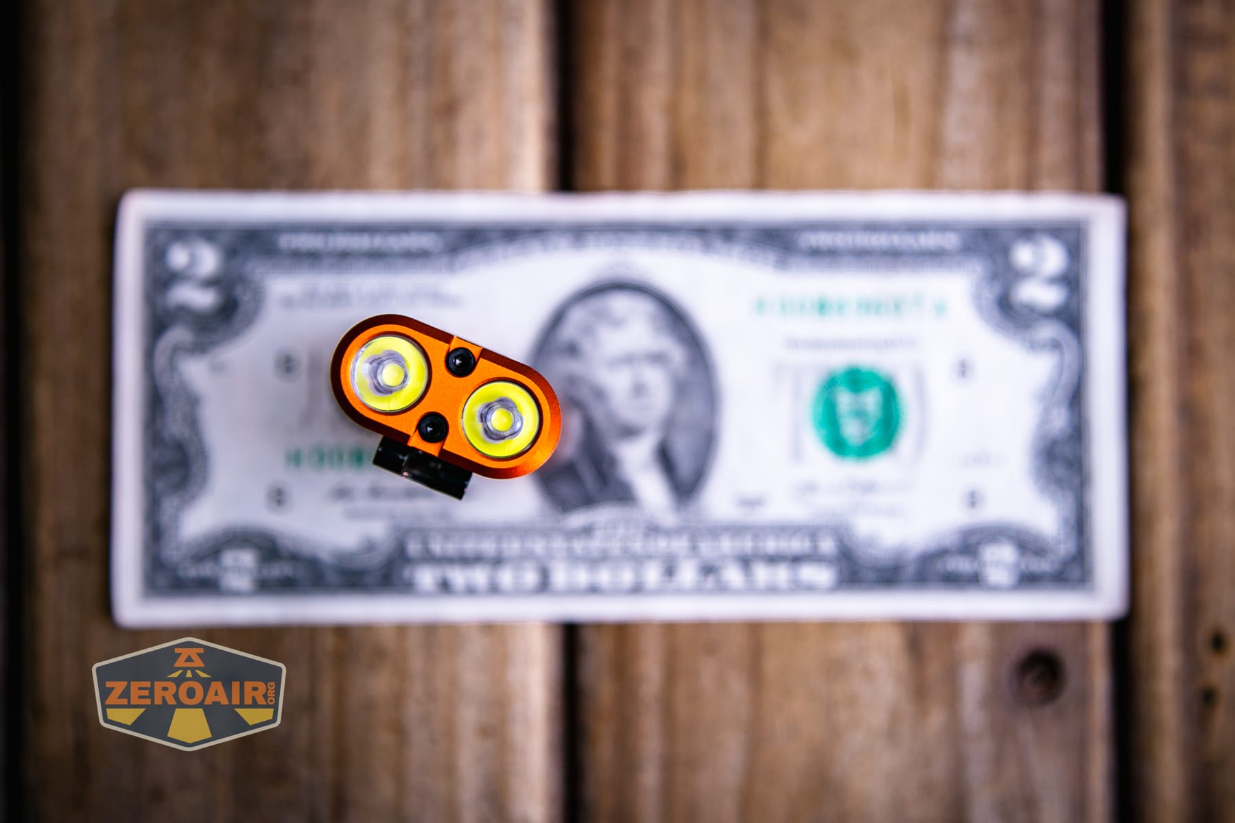 Acebeam UC3A Signal flashlight on a two dollar bill
