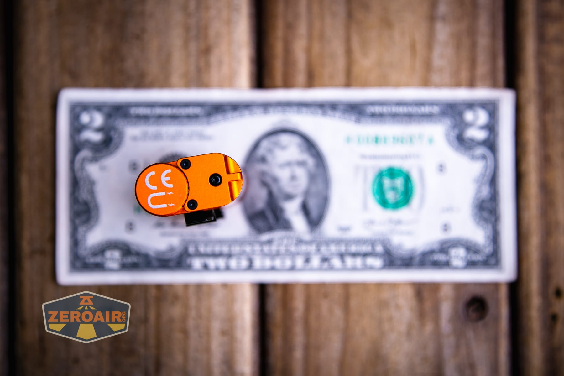 Acebeam UC3A Signal flashlight on a two dollar bill
