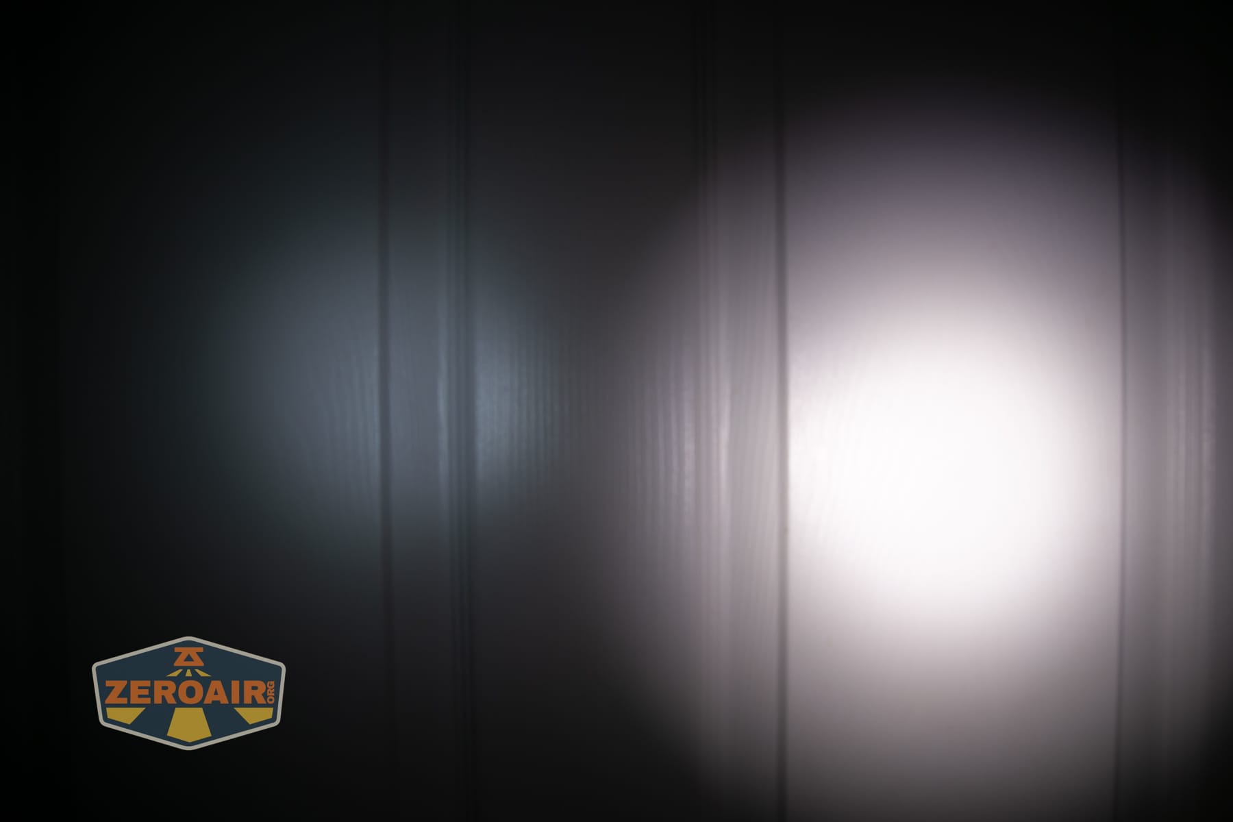 Acebeam UC3A Signal flashlight beamshots on door (at 1') compared to nichia 219b 4500K