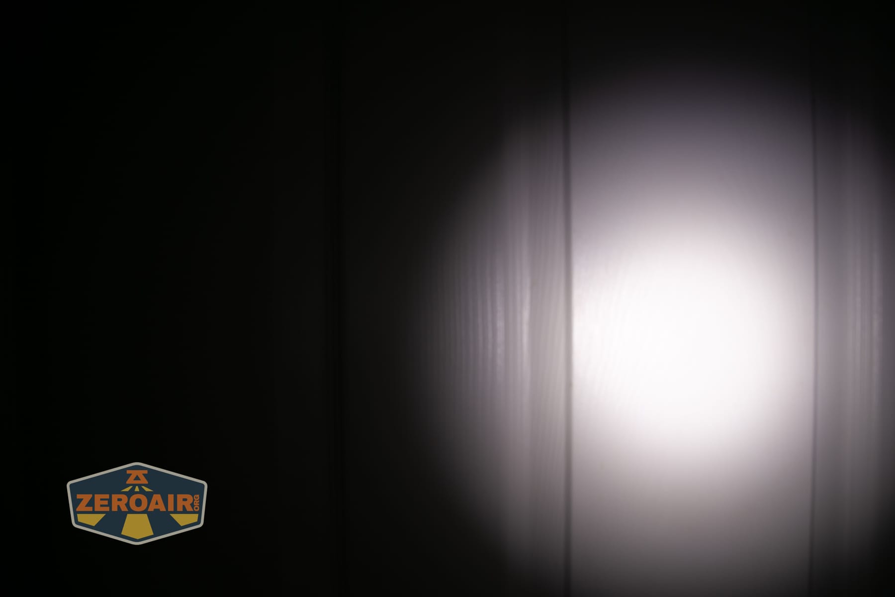 Acebeam UC3A Signal flashlight beamshots on door (at 1') compared to nichia 219b 4500K