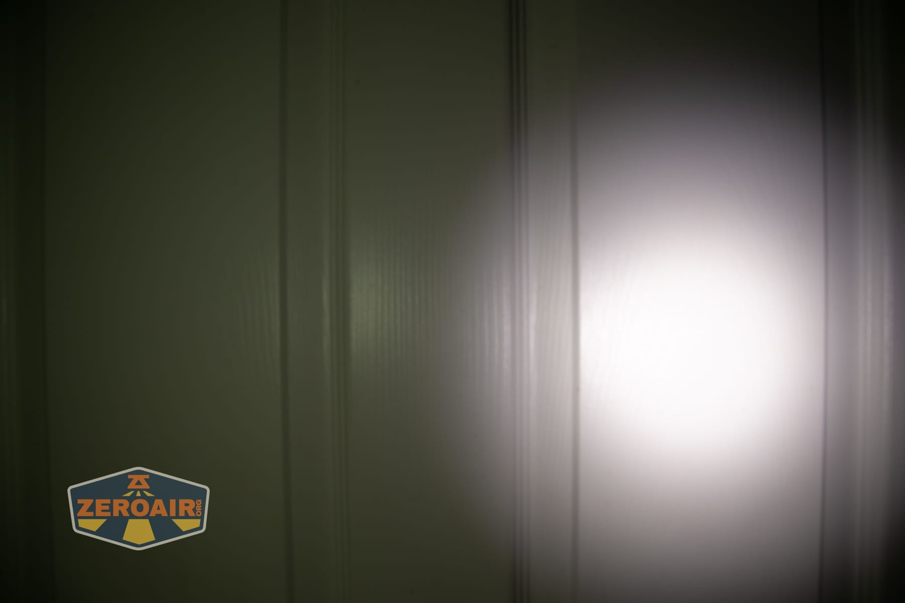 Acebeam UC3A Signal flashlight beamshots on door (at 1') compared to nichia 219b 4500K
